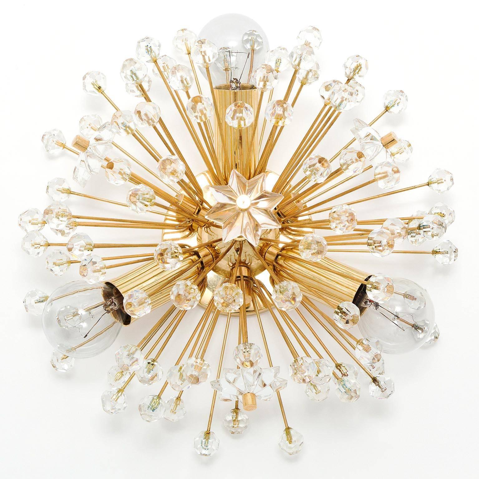 One of three beautiful Viennese snowflake / blowball / sputnik wall lights designed by Emil Stejnar, Austria, manufactured in midcentury, circa 1970 (late 1960s or early 1970s).
High-quality light fixtures made of a 24-carat gold-plated brass frame