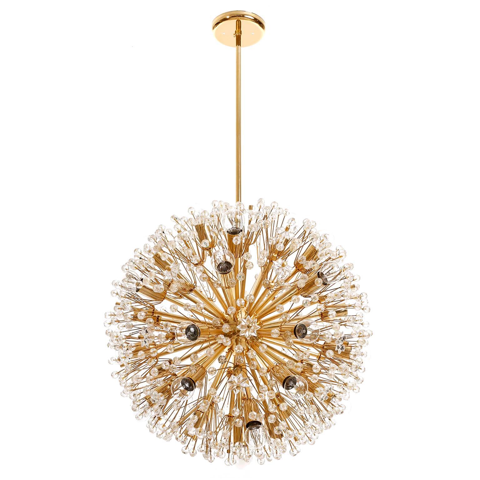A large Sputnik chandelier designed by Emil Stejnar and manufactured in midcentury, circa 1970.
This beautiful light fixture is made of a 24-carat gold plated / gilt / gild brass frame which is decorated with cut glass in the form of beads and