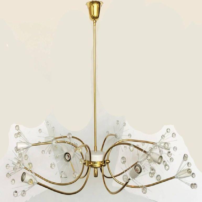 Beautiful Chandelier by Emil Stejnar for Rupert Nikoll twelve-light chandelier in Brass & Glass, Mid-Century Modern  made in Austria.
In US rewired working condition and takes 12 light bulbs with max. 60 watts.
Original good condition.