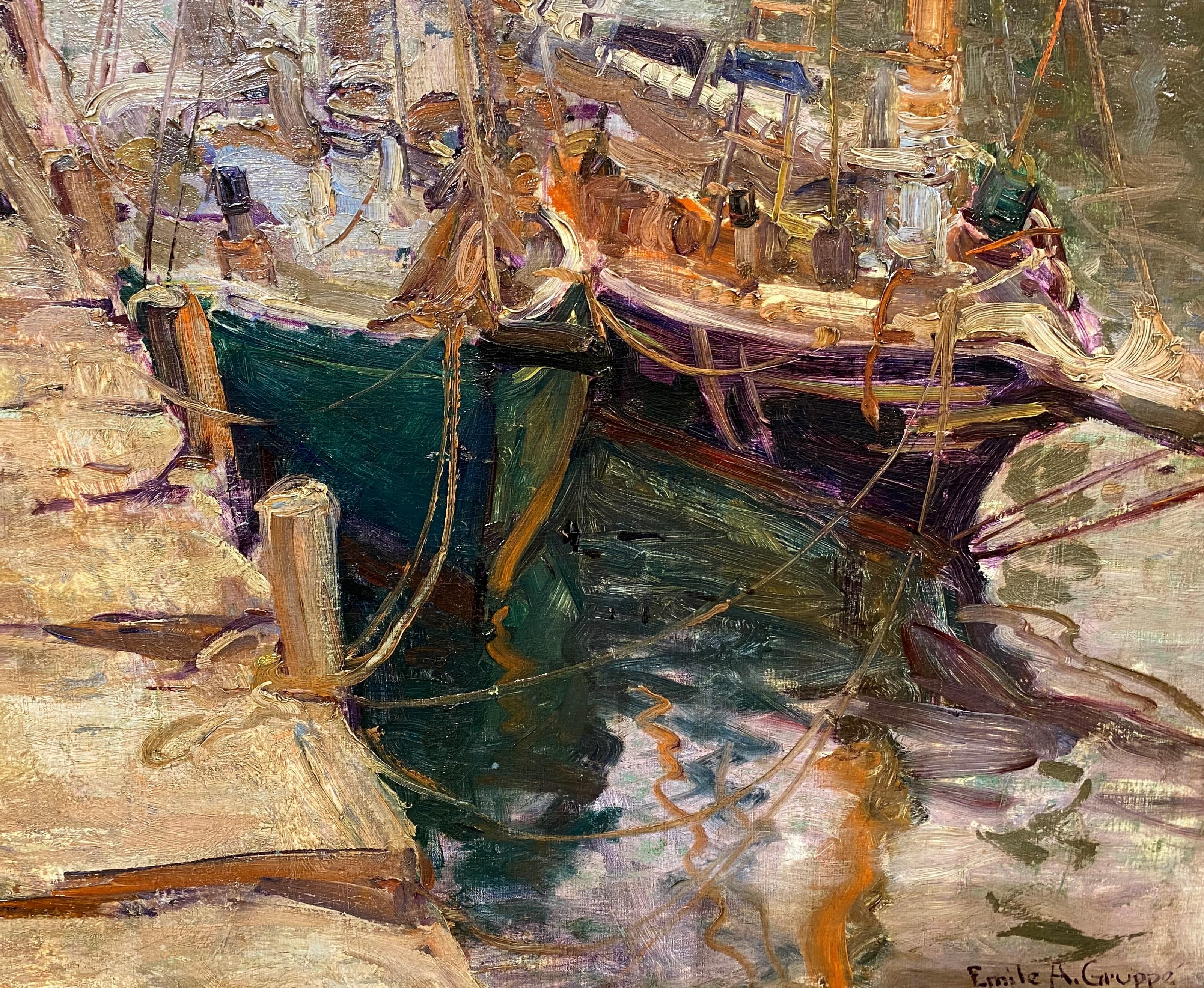 A fine impressionist marine harbor scene with boats in Gloucester by American artist Emile Albert Gruppe (1896-1978). Gruppe was born in Rochester, NY, and went on to become a renowned New England landscape and marine painter, best known for his