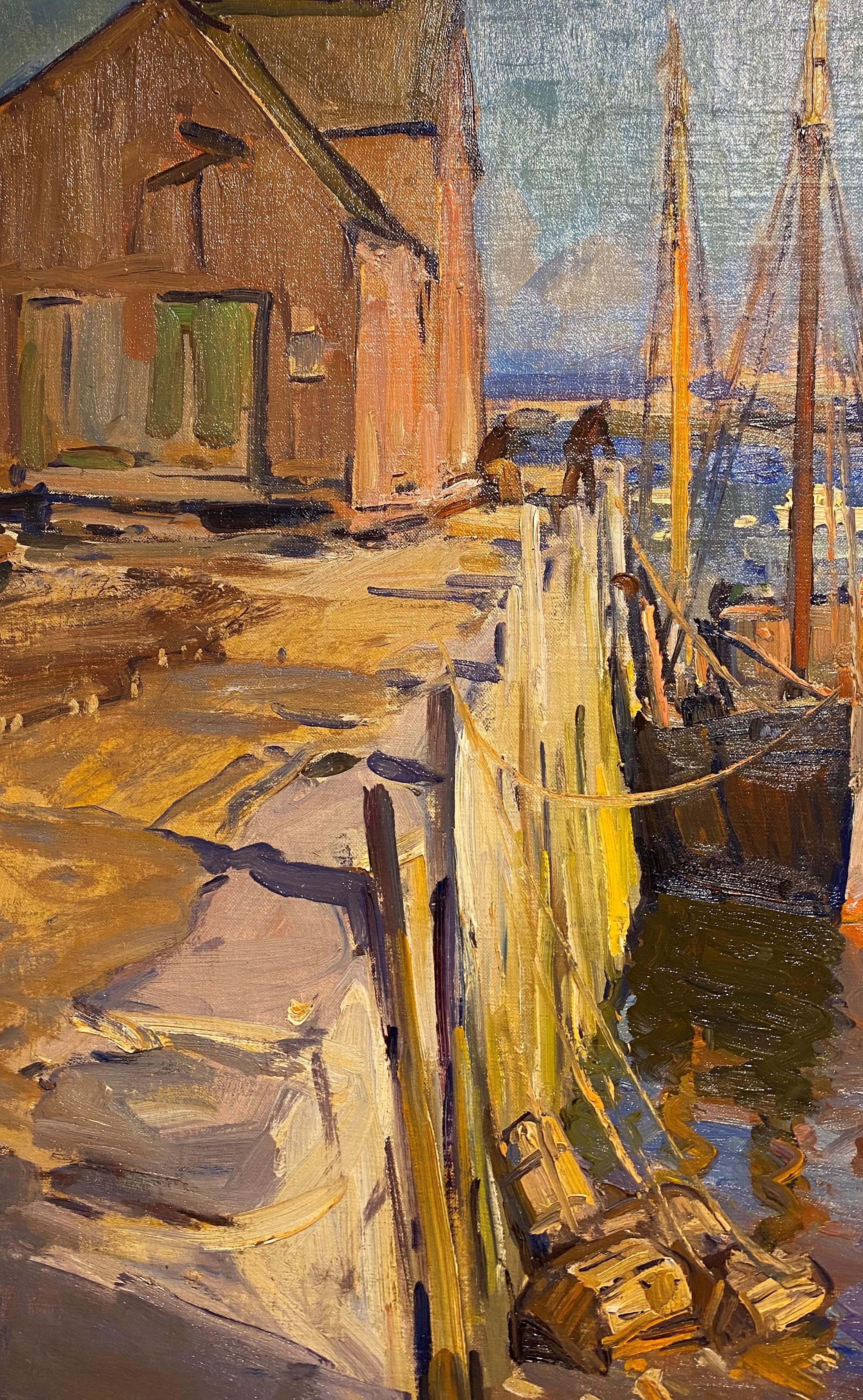 A colorful Cape Ann, Massachusetts marine harbor scene with boats docked by American artist Emile Albert Gruppé (1896-1978). Gruppé was born in Rochester, NY, and is renowned for his New England landscapes and vigorous portrayals of the harbors and