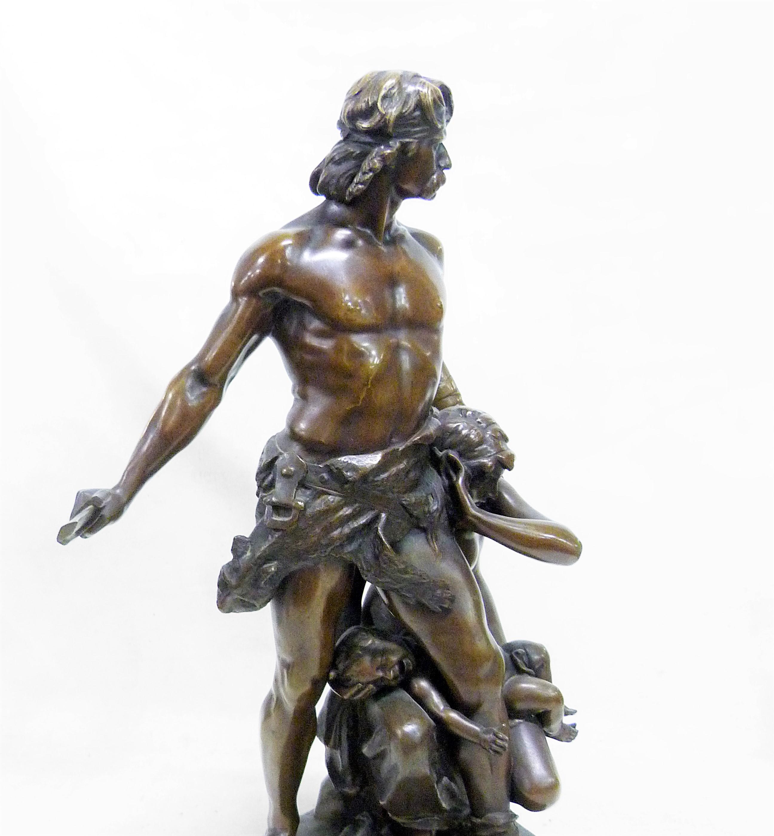 Massive bronze group with medal patina depicting a standing Gaulish warrior protecting his wife and child scared. Signature of the sculptor Boisseau on the base, titled in a cartouche 