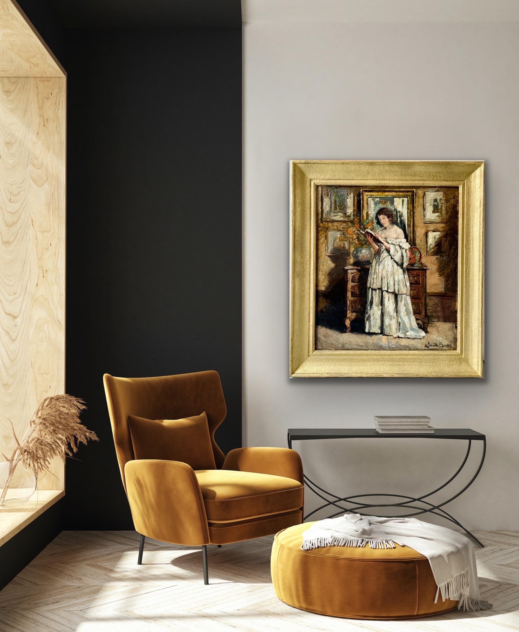 Large 19th century Romantic oil painting of a lady in belle epoque interior

This fine painting depicts an elegantly dressed lady standing in a belle epoque interior. The young woman is wearing a luxurious white off-shoulder gown and is looking at a