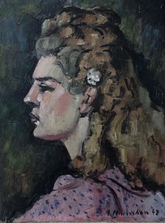 Young blonde woman posing in profile