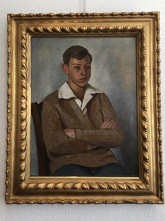 Young man sitting white collar and polka dot sweater