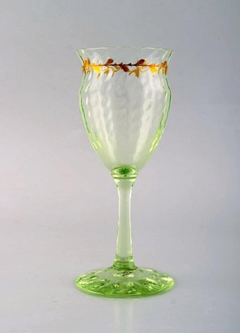 Emile Gallé (1846-1904). Six early and rare wine glasses and carafe in mouth-blown light green art glass with hand painted gold decorations in the form of leaves. Museum quality, 1870s-1880s.
Wine glasses measure: 16.5 x 7 cm.
Carafe measures: 28