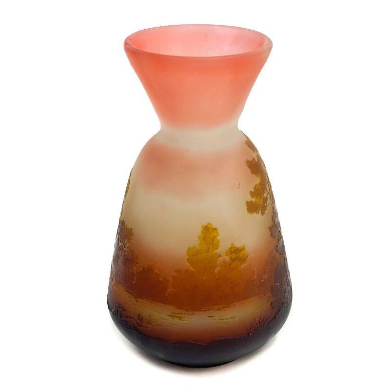 Emile Galle Acid Etched 3 Color Scenic Lake View Cameo Glass Vase, circa 1890

Emile Galle acid etched 3 color Scenic Lake View cameo glass vase, circa 1890. 3 tone pink, burnt orange to wine red with a beautiful scenic lake view scene with trees