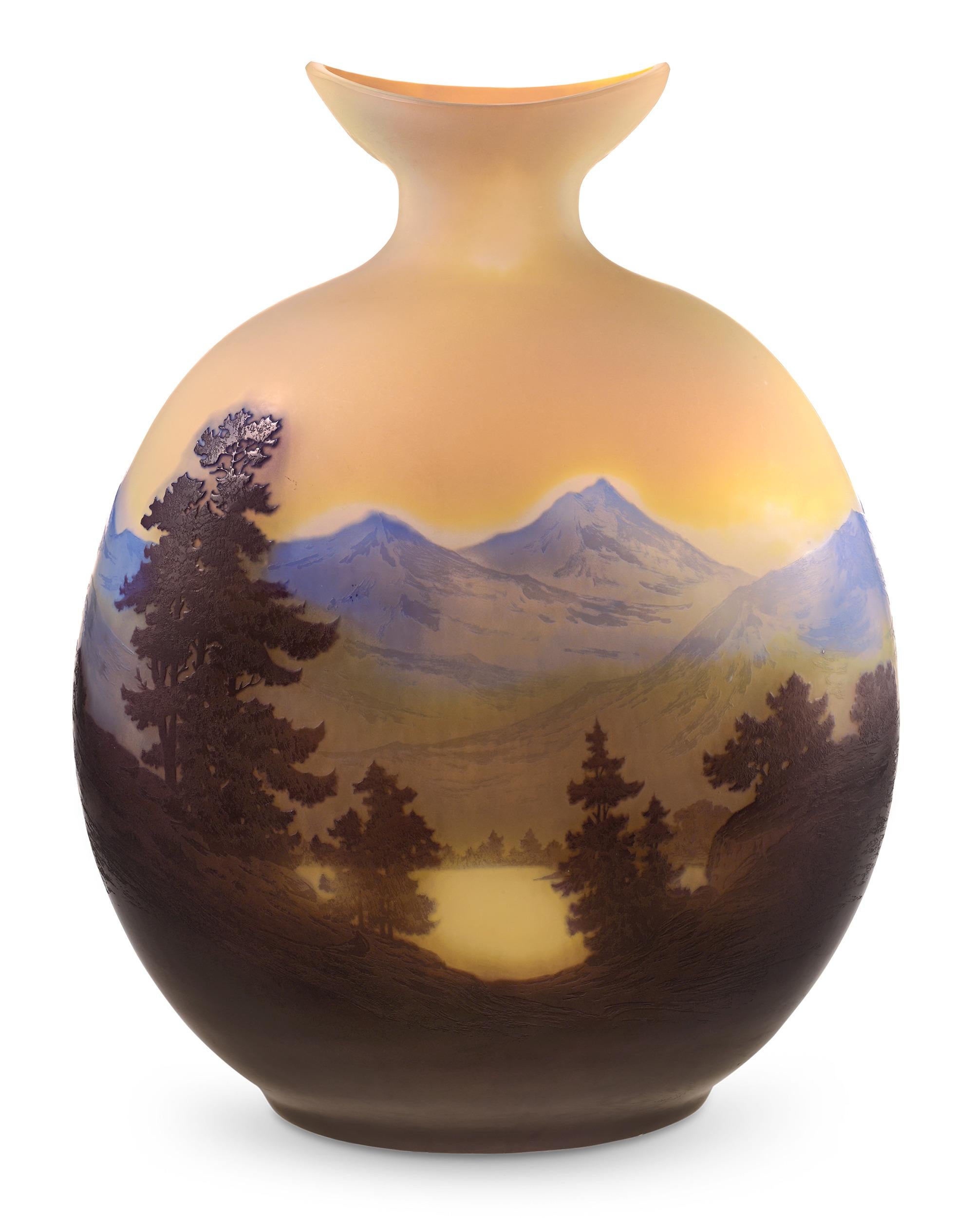 Exceptional in both size and artistry, this sand-polished cameo art glass vase from the famed Art Nouveau master Émile Gallé features an exceedingly rare alpine scene. The artist's love of nature is evident in the detailed rendition of mountains