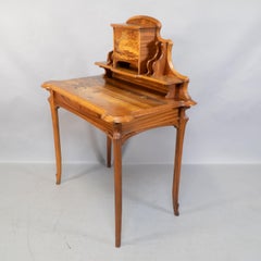 Emile Galle. An Art Nouveau Walnut writing desk with exceptional inlaid scenery