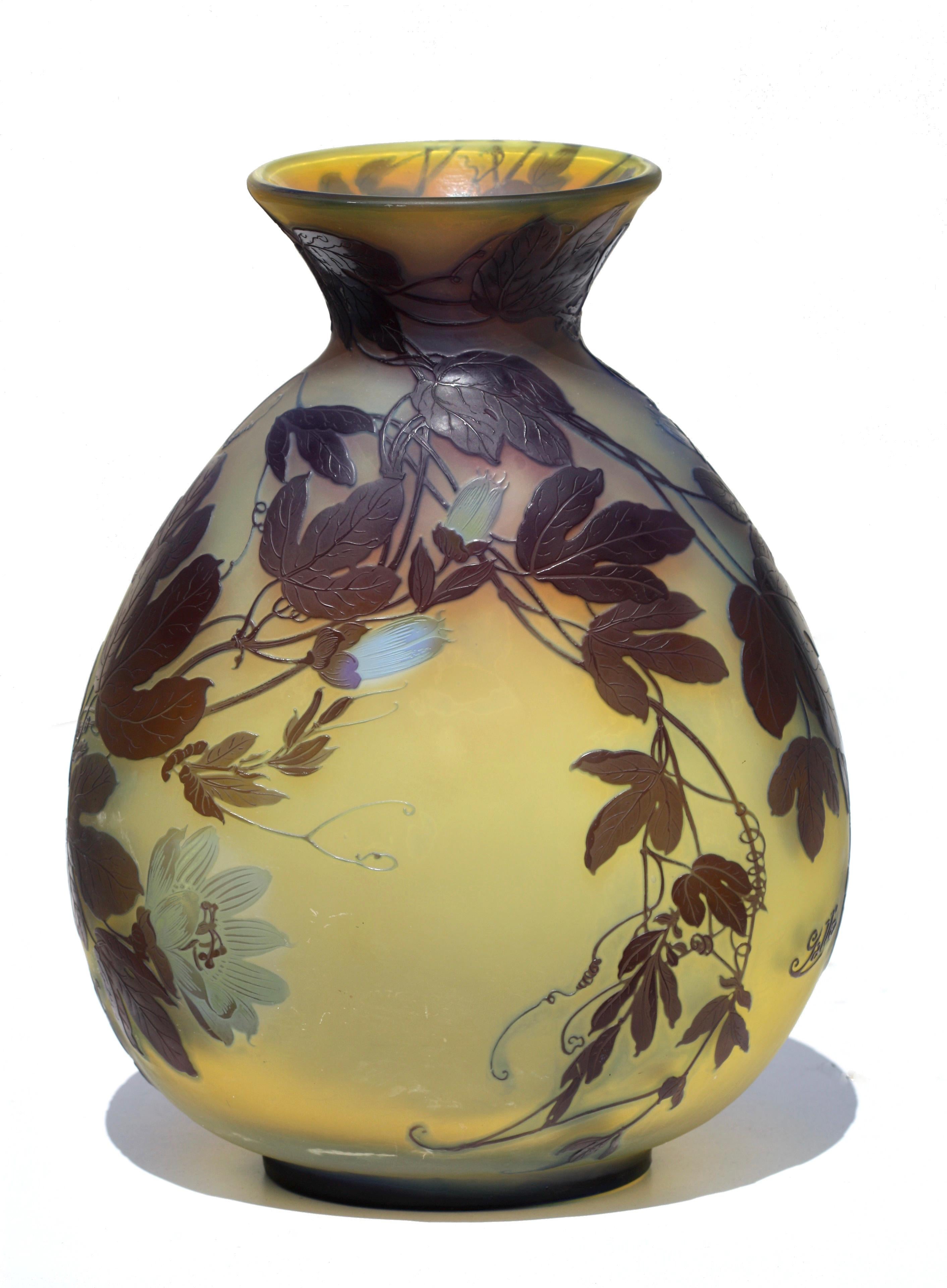 Émile Gallé
An impressive Gallé cameo glass vase
circa 1900
colourless glass with a degrading amber layer overlaid in brown and pale green, etched and cut with pendant flower blossoms
cameo mark 'Gallé'
underside stamped 
Fabrication