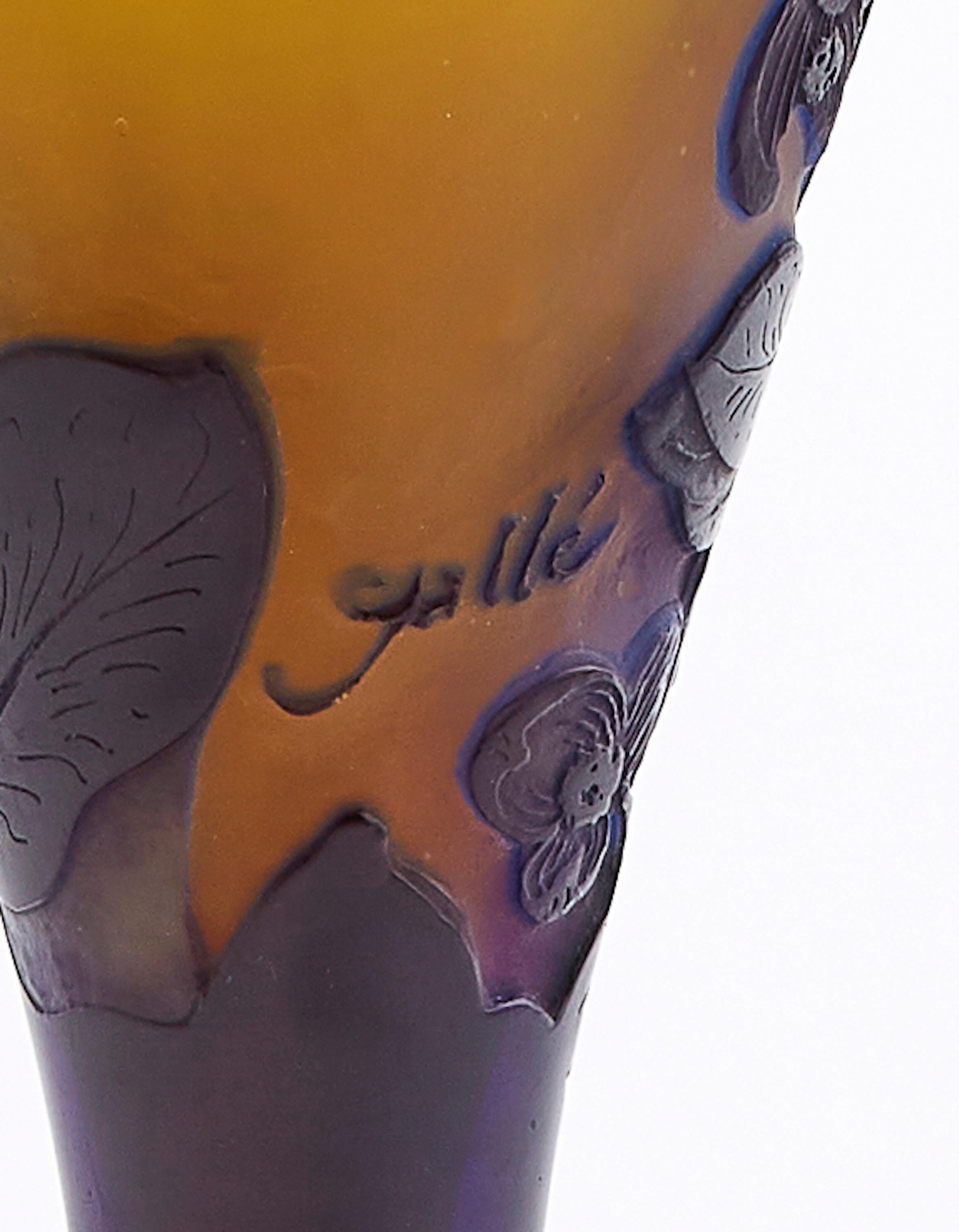 Emile Galle Art Deco Vase

Beautiful Art Deco piece that was made in France in the 1930s
An overlaid and etched glass vase, cameo signature Gallé. 
Beautiful orange, purple and white colors combining a special look on the vase. Decorated with