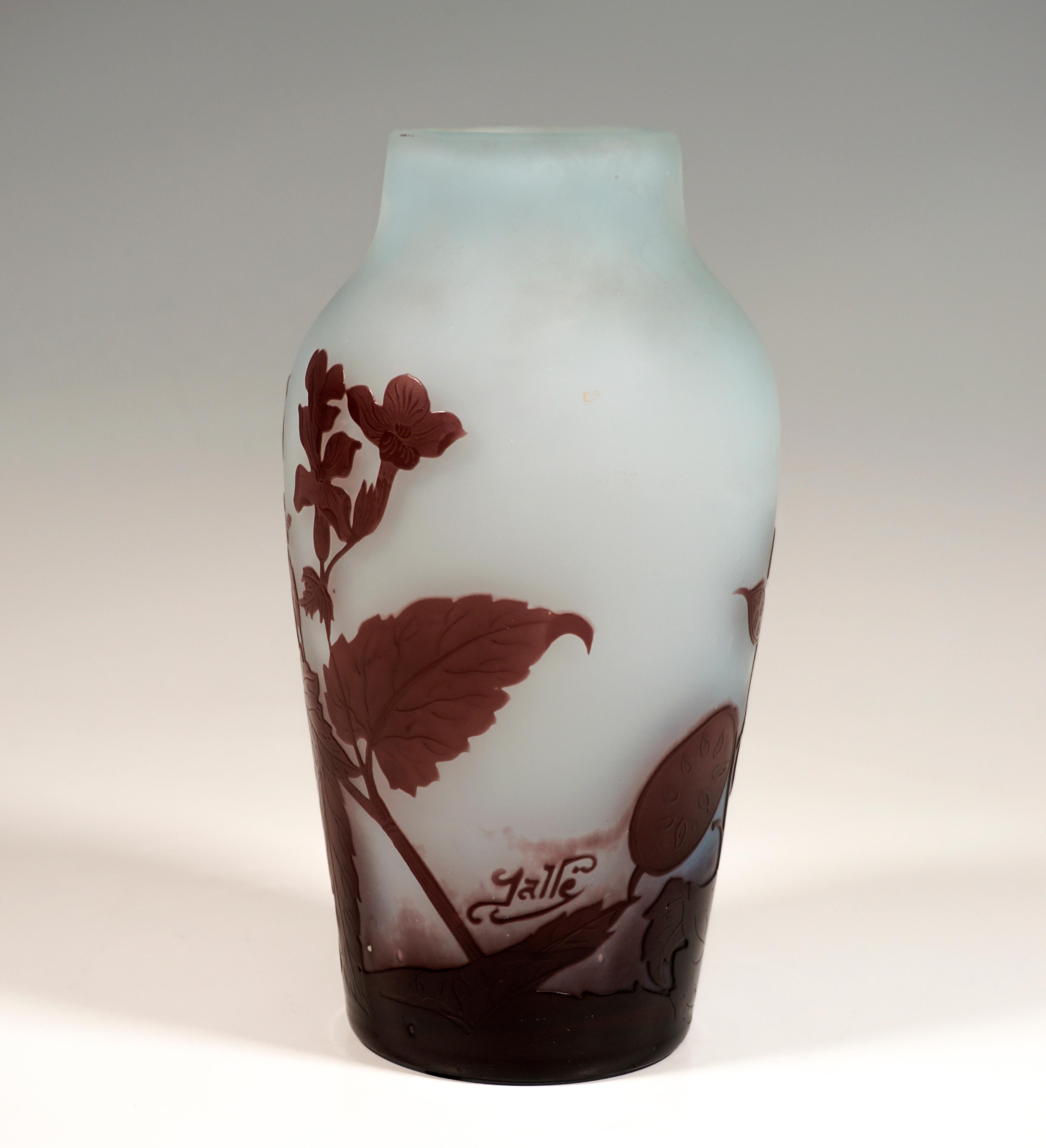 Vase in the form of a baluster: Flush foot, high, bulbous body with set off, short neck on gently sloping shoulders. Colorless glass with light blue color powder inclusions, burgundy overlaid on the outside, highly etched floral decoration with