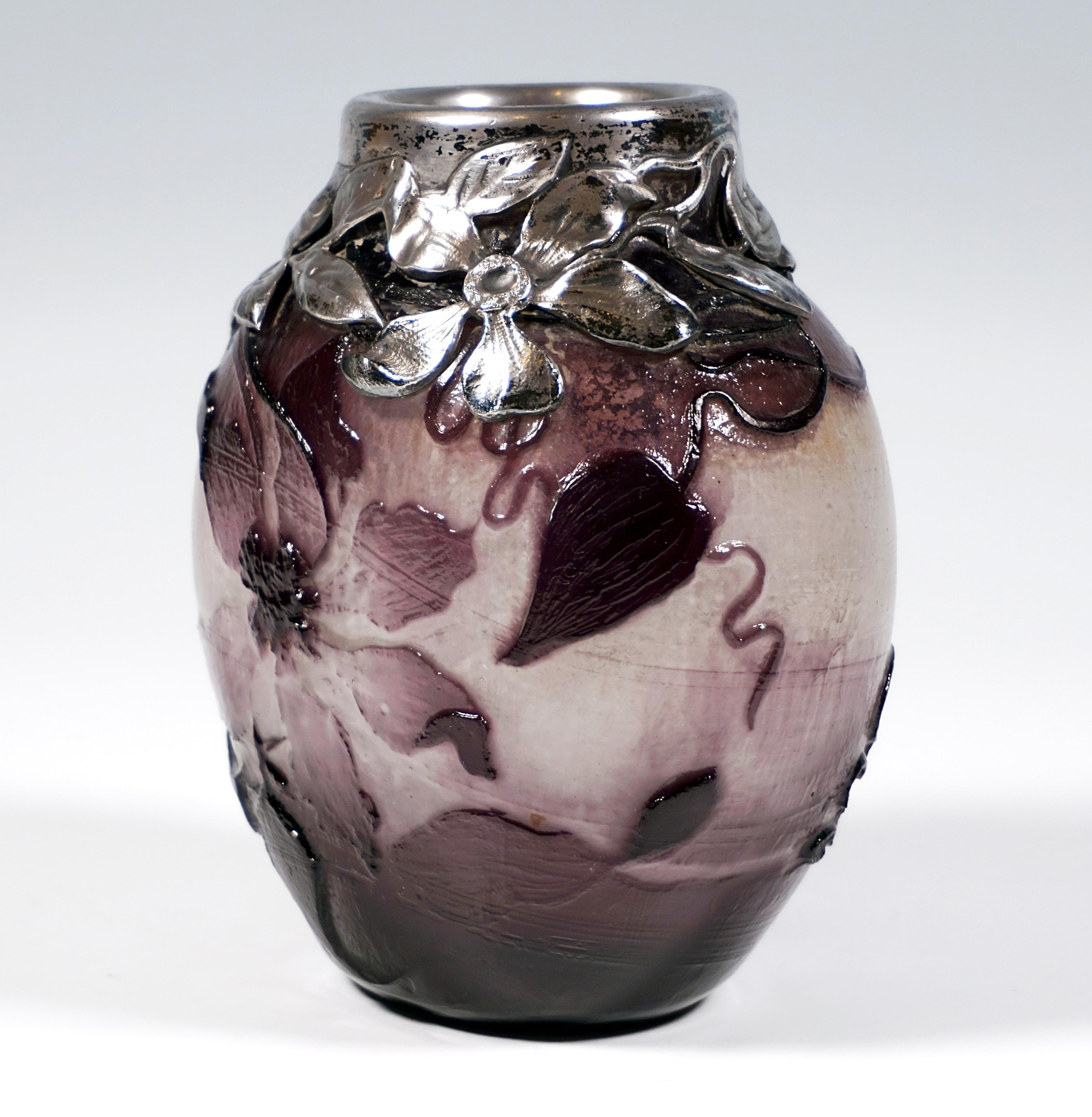 Bulbous vase with an elliptical cross-section on a flush stand, short neck piece raised at the top centre with silver mounting with artistically sculpted flowers and leaves, colourless glass with white powder fusions, violet overlay, highly etched