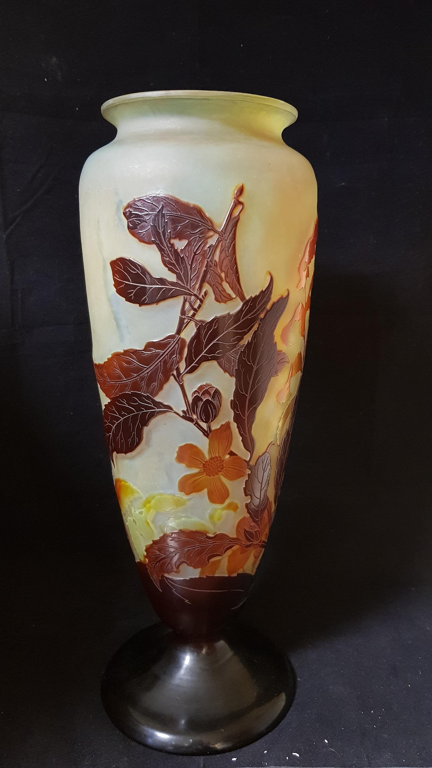 Emile Gallé, France, (early 1900): multi-layered glass vase with a light background and decoration with brown vegetable motifs
Signed.