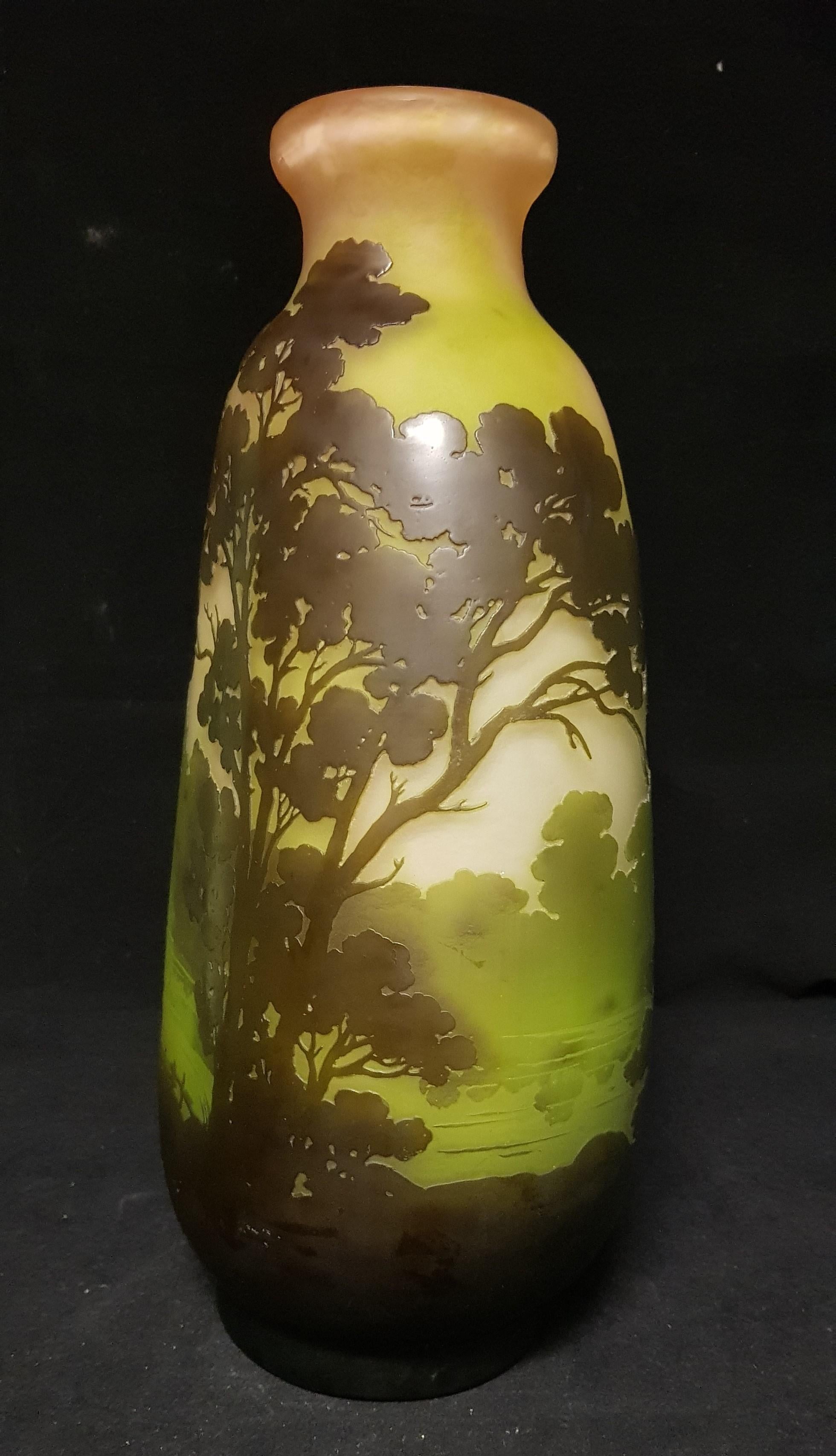 Glass vase with decoration of the lake landscape in the colors of green and brown
signed.