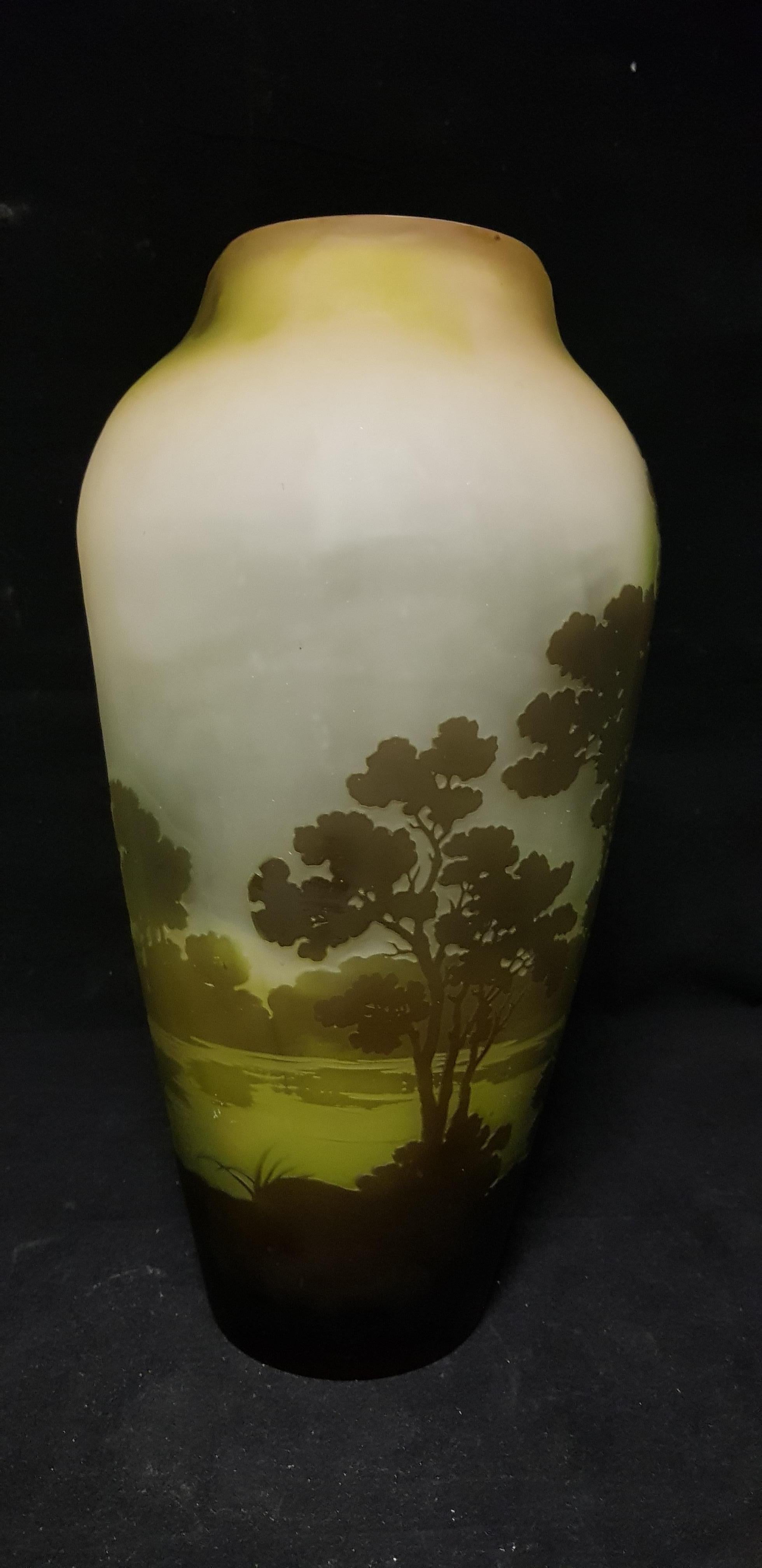 Glass vase with decoration of the lake landscape in the colors of green and brown
signed
Same form is published on art signed 