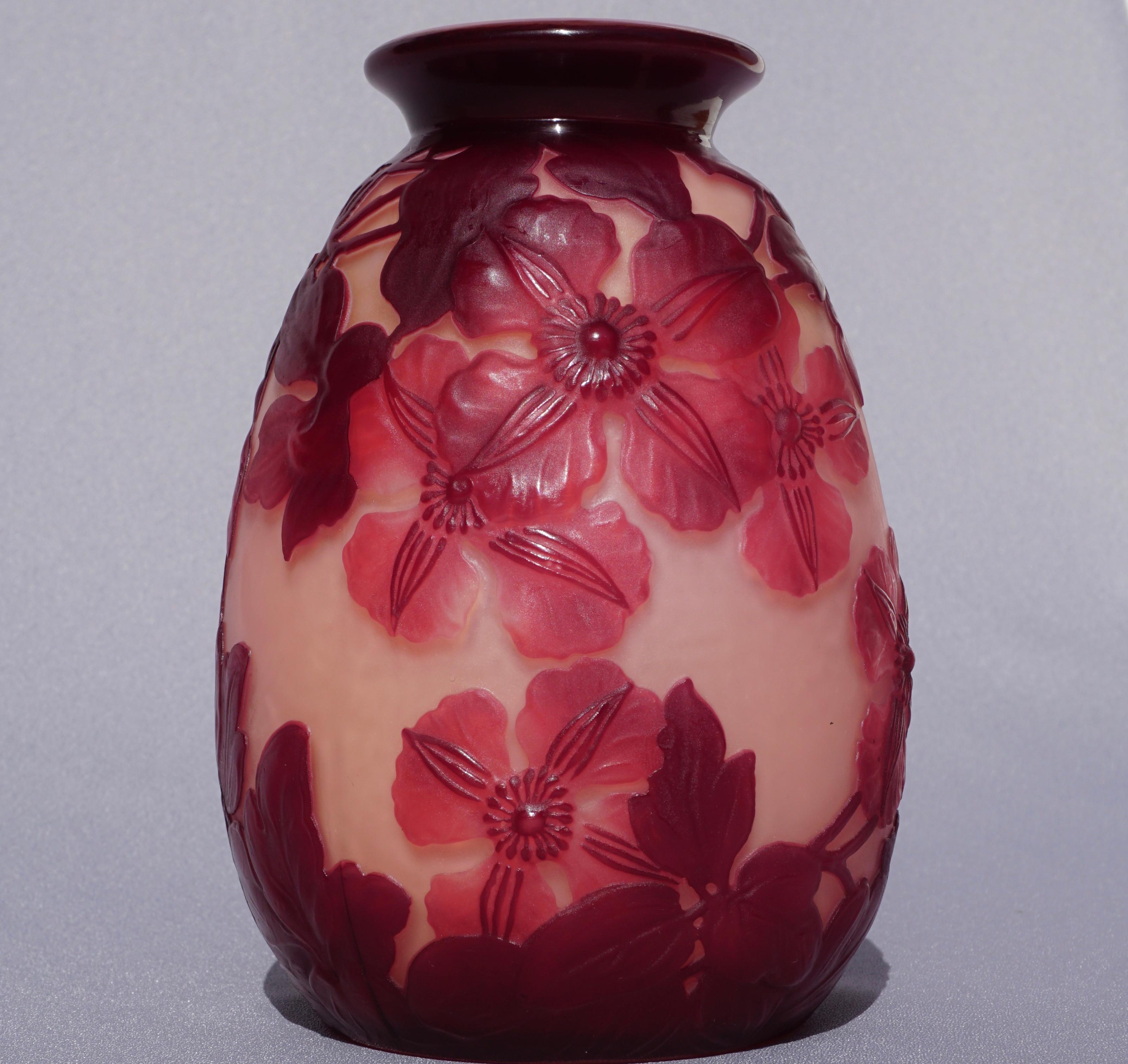 An Art Nouveau Emile Galle mold blown glass Clematis vase, circa 1900

This beautiful Gallé clematis blownout vase has a white layer below the two different red layers. This extra pink case layer is crucial. The vase 
