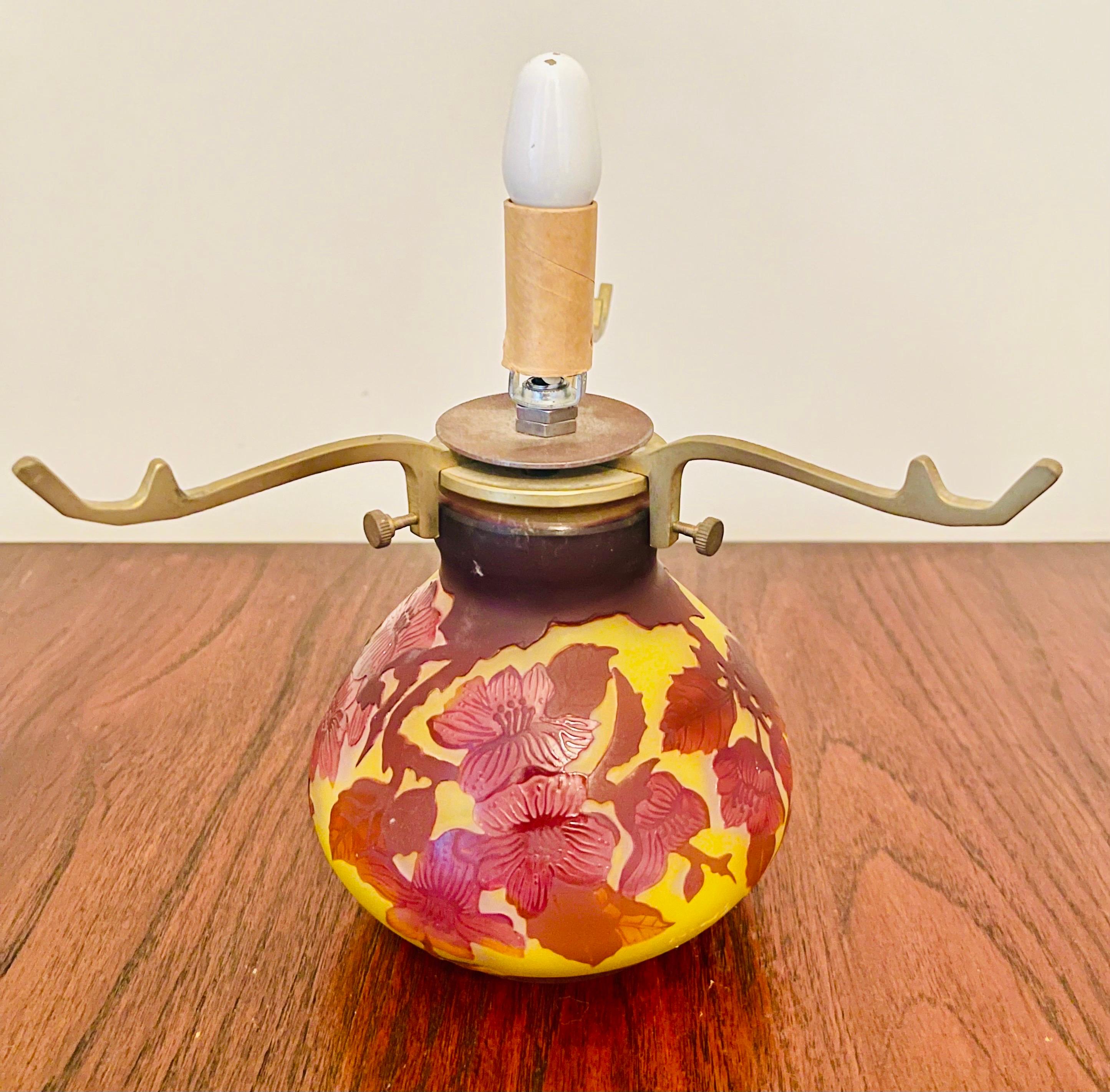 This exquisite piece of art is a signed Emile Galle cameo glass windowpane floral Art Nouveau vase that looks like it has been transformed to a table lamp, although we are unclear where the electricity is, and note that it is being sold exactly as