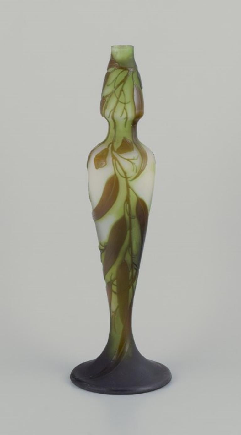 Émile Gallé (1846-1904), France.
Colossal art glass vase with floral motifs in shades of green. 
Pâte de verre technique. A rare model.
Approximately 1920.
Marked.
In perfect condition.
Dimensions: H 52.0 cm x D 16.0 cm.