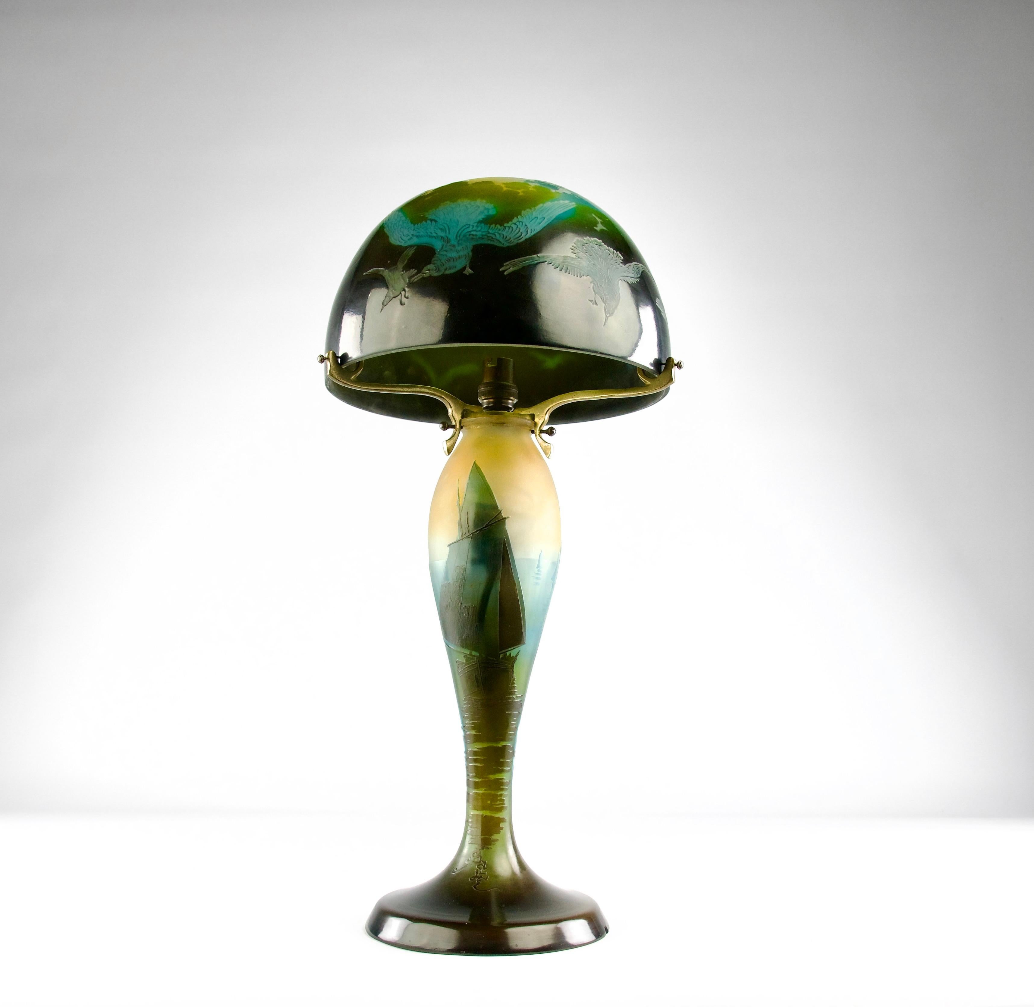 Superb and rare blue hued sailors and seagulls Gallé table lamp, France circa 1920s.

In very good condition.

Dimensions in cm ( H x D ) : 51 x 24

Secure shipping.

Émile Gallé was a French artist and designer who worked in glass, and is