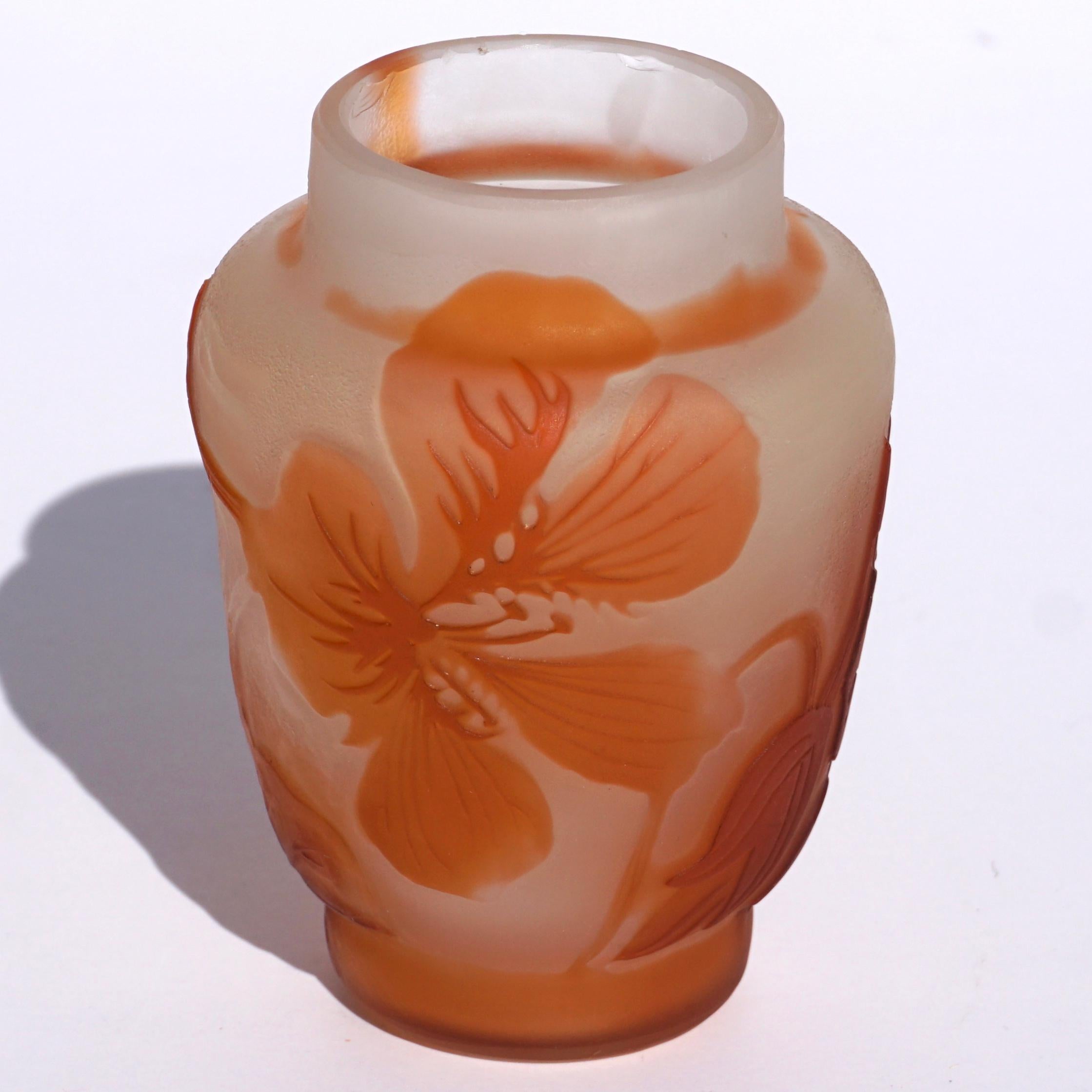 A delightful Japonesque floral vase by Emile Galle circa 1900. Wheel carved and acid etched in cameo with a cream background showing beautiful floral leaves and flowers.

Raised signature in cameo “Galle”

Measures: Height 3.25 inches. diameter 2.3