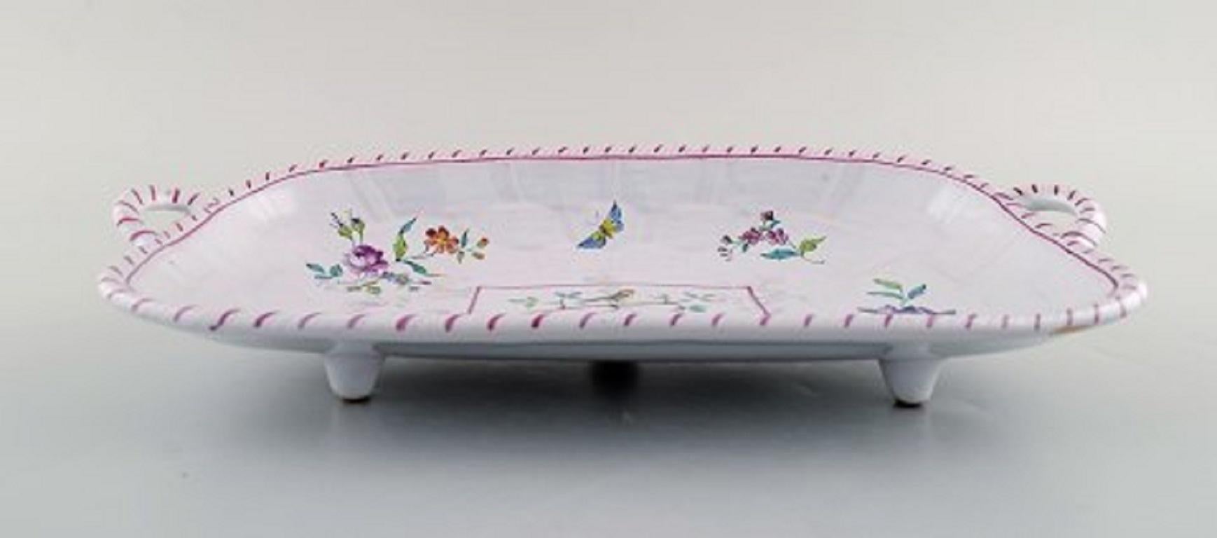 Emile Gallé for St. Clement. Dish on four feet in hand painted faience. Decorated with flowers and birds, 1870s.
In very good condition.
Signed.
Measures: 30.5 x 15.5 x 6.5 cm.