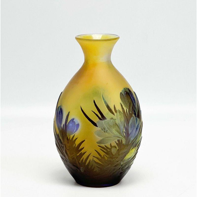 Emile Galle France acid etched 3 layer cameo glass vase blue crocus flowers.

Emile Galle France acid etched 3 layer cameo glass vase, circa 1900. A yellow background with blue crocus flowers and leaves to the body. Signed Galle in cameo to the