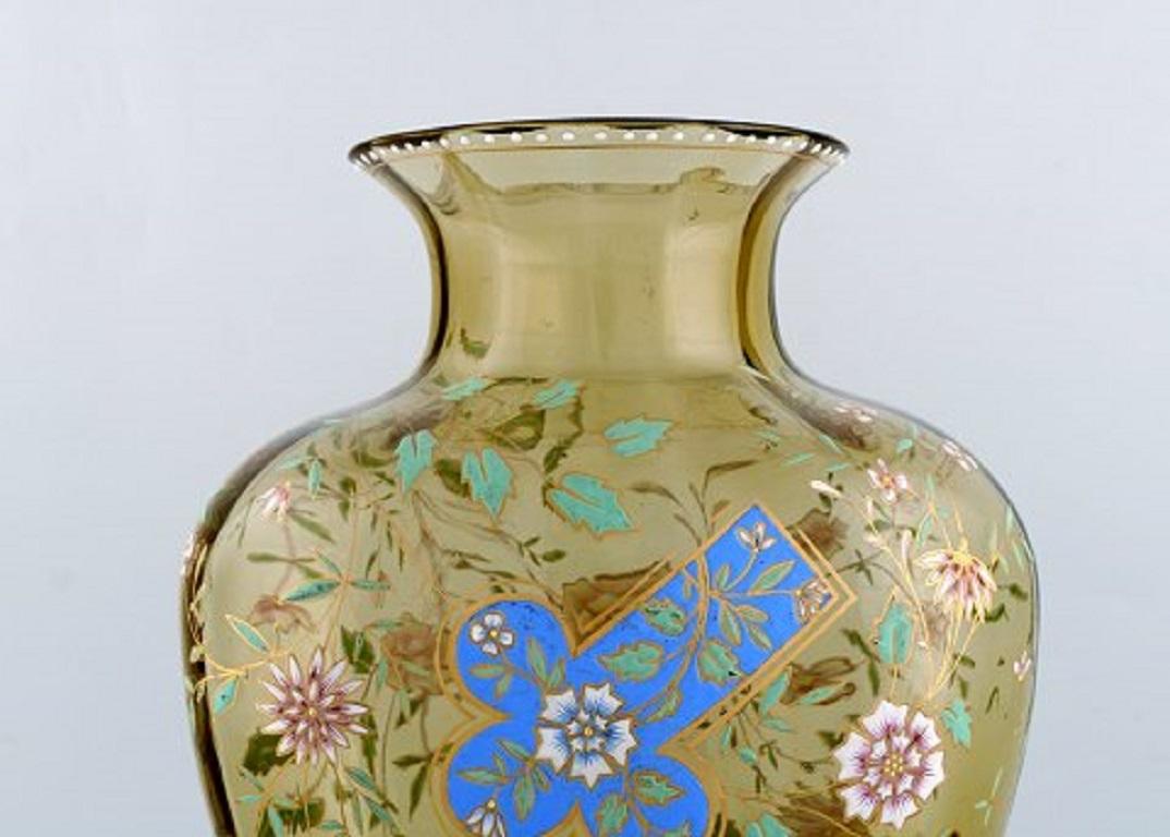 Emile Gallé, France. Large antique vase in smoke-colored art glass with flowers, branches and cross in enamel. Museum quality, 1890s.
Measures: 33.5 x 22 cm.
In very good condition.
Signed: Gallé.