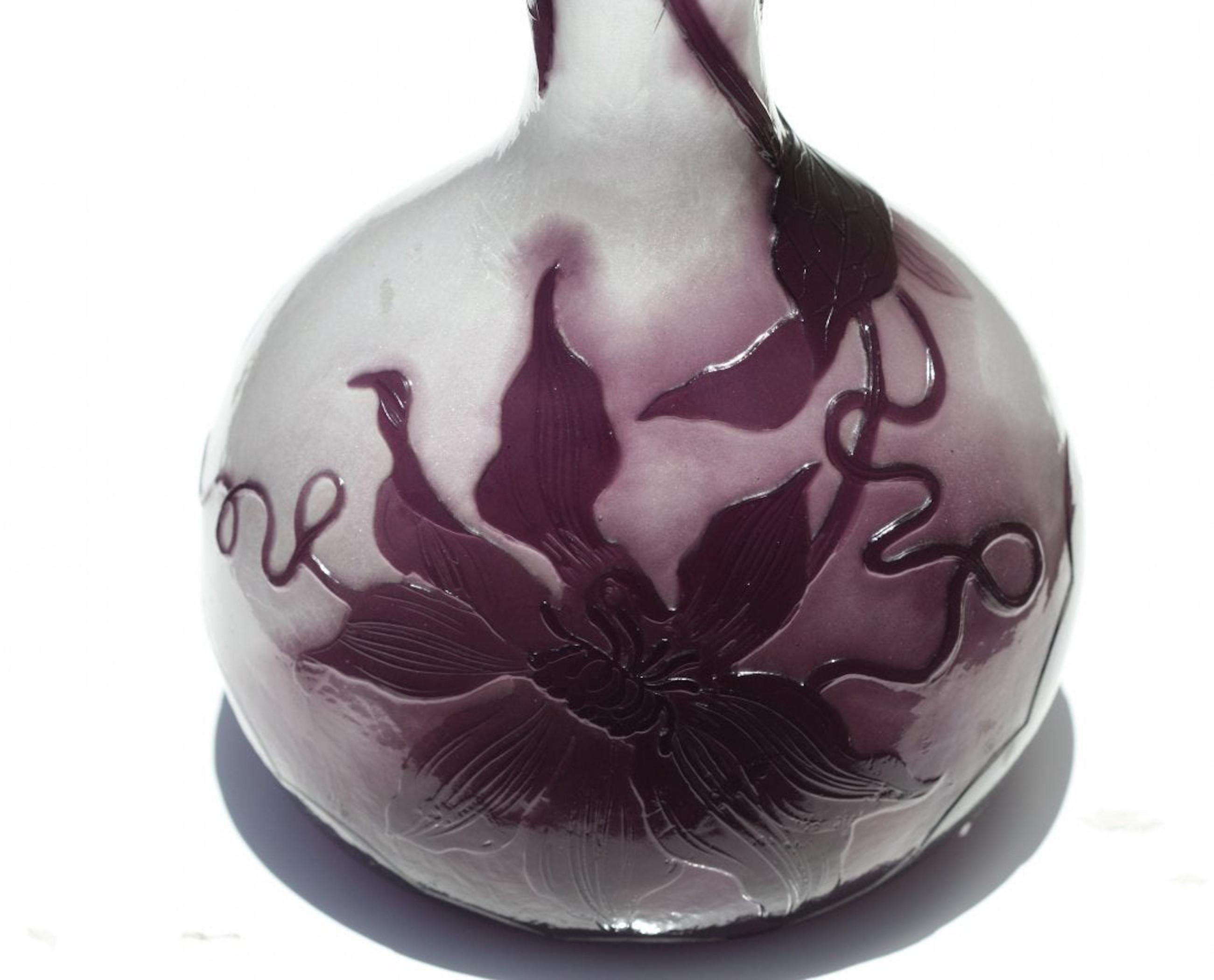 Emile Gallé, French (1846-1904) fine fire-polished vase 
A Fine etched, carved, and fire-polished Cameo Glass Vase 'Lilly', circa 1900. 
Height 13.5 in. (34.29 cm.), 
signed Gallé Depose

Emile Gallé was a master craftsman who skillfully