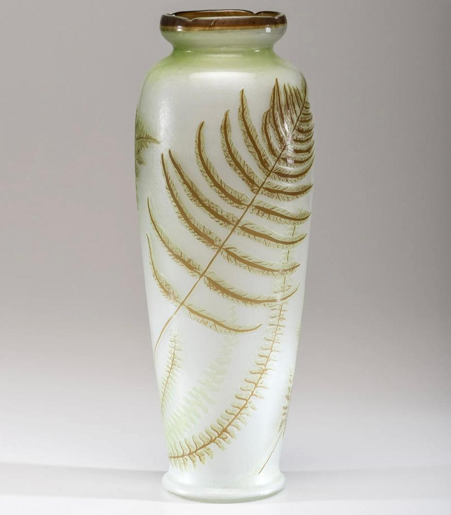 Emile Galle (French, 1846 -1904)
A substantially large 16 inch Emile Galle art nouveau cameo, wheel carved and fir polished glass vase with green and brown ferns on a cream background.
Signed in cameo 'Galle' on body
Height 16 inches x 6 Inch