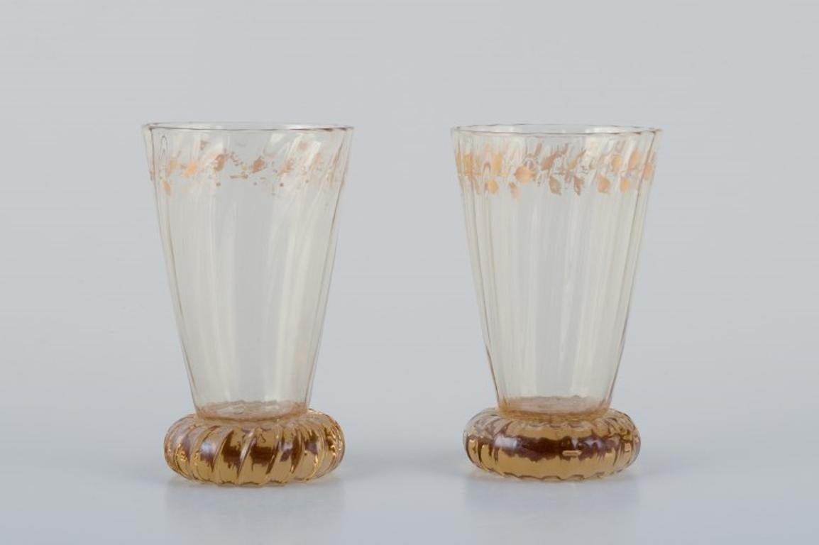 Emile Gallé (1846-1904), French artist and designer.
Two small crystal glasses hand-decorated with gold leaf motifs.
1870s/1880s.
Signed: 