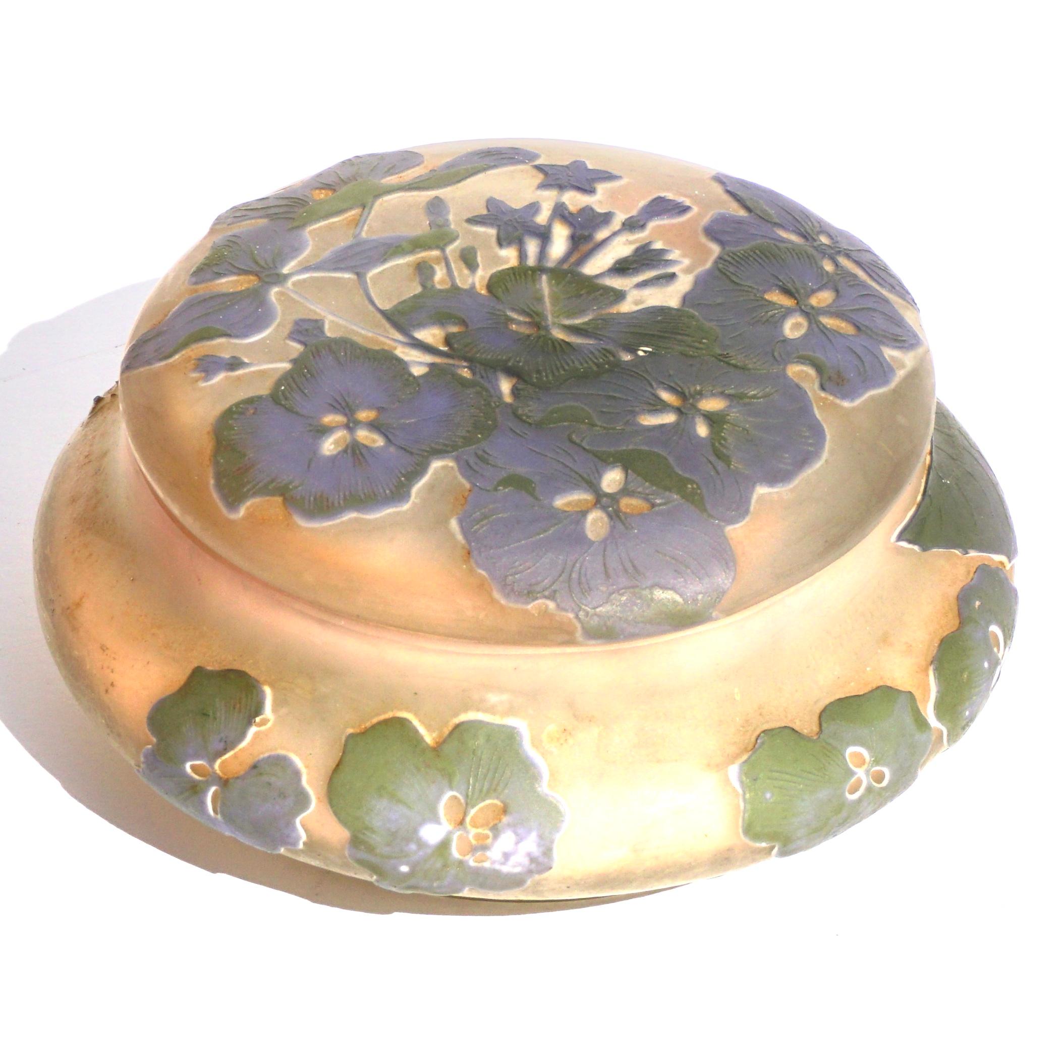 Gallé Cameo glass wheel carved and acid etched hydrangeas covered box, circa 1910. Art Nouveau.

Marks: (star) Gallé (1904-1907)

Height: 3 Inches, diameter 5.75 inches (7.4 x 14.6 cm)

Condition: very good with no damage or repairs. Could use
