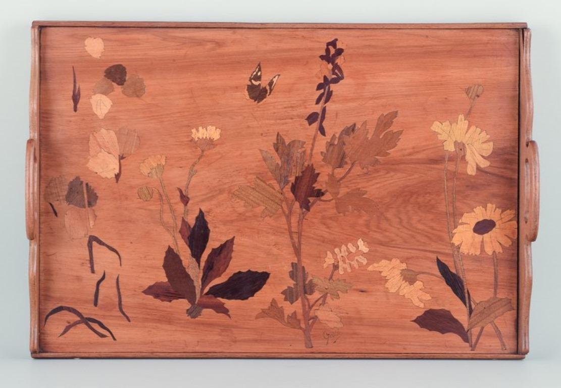 Emile Gallé (1846-1904), French artist and designer. 
Large tray made of fruitwood. Inlaid with floral motifs in various types of wood.
Late 19th century.
Signed.
In perfect condition.
Measurements: L 55.0 cm x W 37.5 cm x H 7.5 cm, including