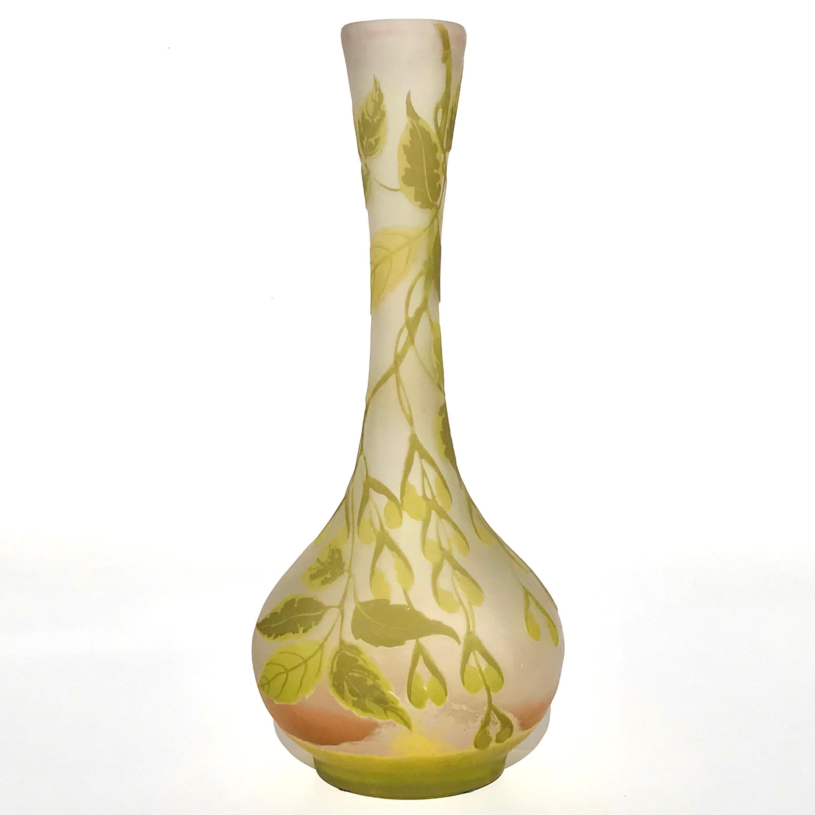 Emile Gallé Cameo Glass Leaves and Pods Vase, circa 1900
Marks: Gallé
Height: 15.25 inches (38.7 cm)
Width: 6.5 Inches Depth: 5 Inches

Condition: Tall vase of colorless glass overlaid in peach, chartreuse and green acid-etched with cascading