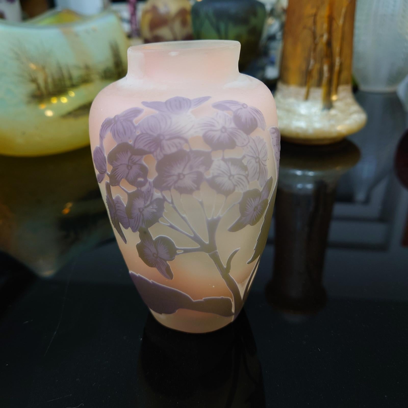Emile Gallé, Nancy, Art Nouveau Cameo Vase with Hydrangeas - France ca. 1904.
Polychrome overlaid decoration with hydrangeas on a milky and pink background, marked Gallé with a star, 12 cm high, mouth slightly slanted.