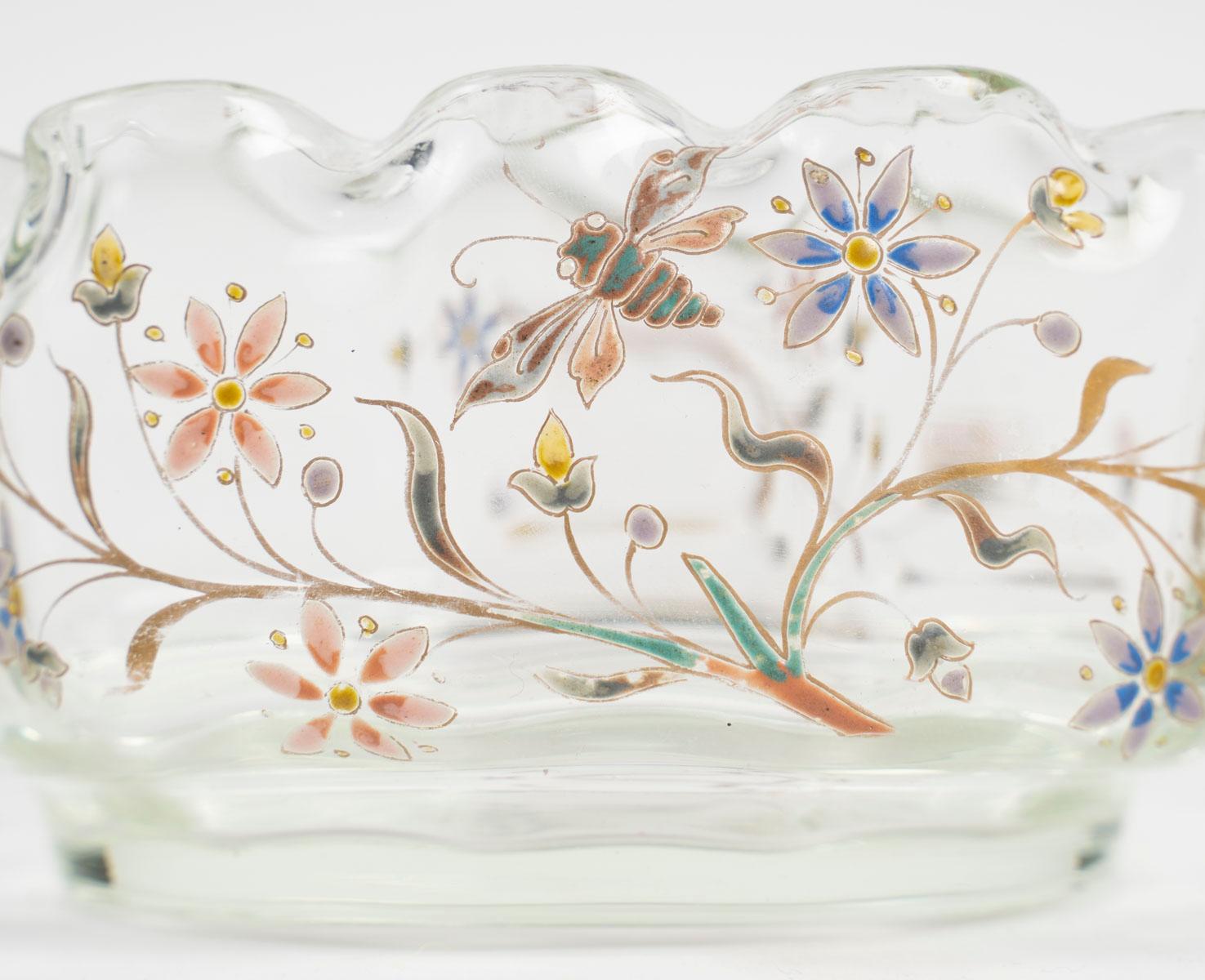 Rare multi-lobed cup in hot drawn glass with enamelled decoration of vegetation and a dragonfly flying over the branches. Art Nouveau period work signed under the base 