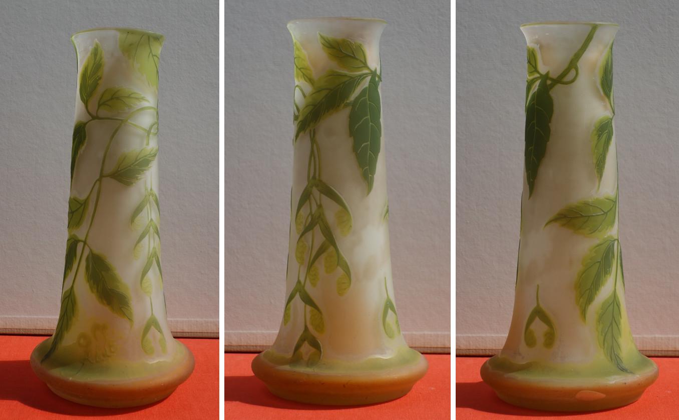 Emile GALLE
Tall Cameo Glass Vase with Maple ornaments 

Crafted in Nancy (Lorraine) c. 1905
Bearing Galle 'Japanese style' signature in cameo
Made of white opalescent glass with light orange shades, overlaid in cameo pale green ornaments of