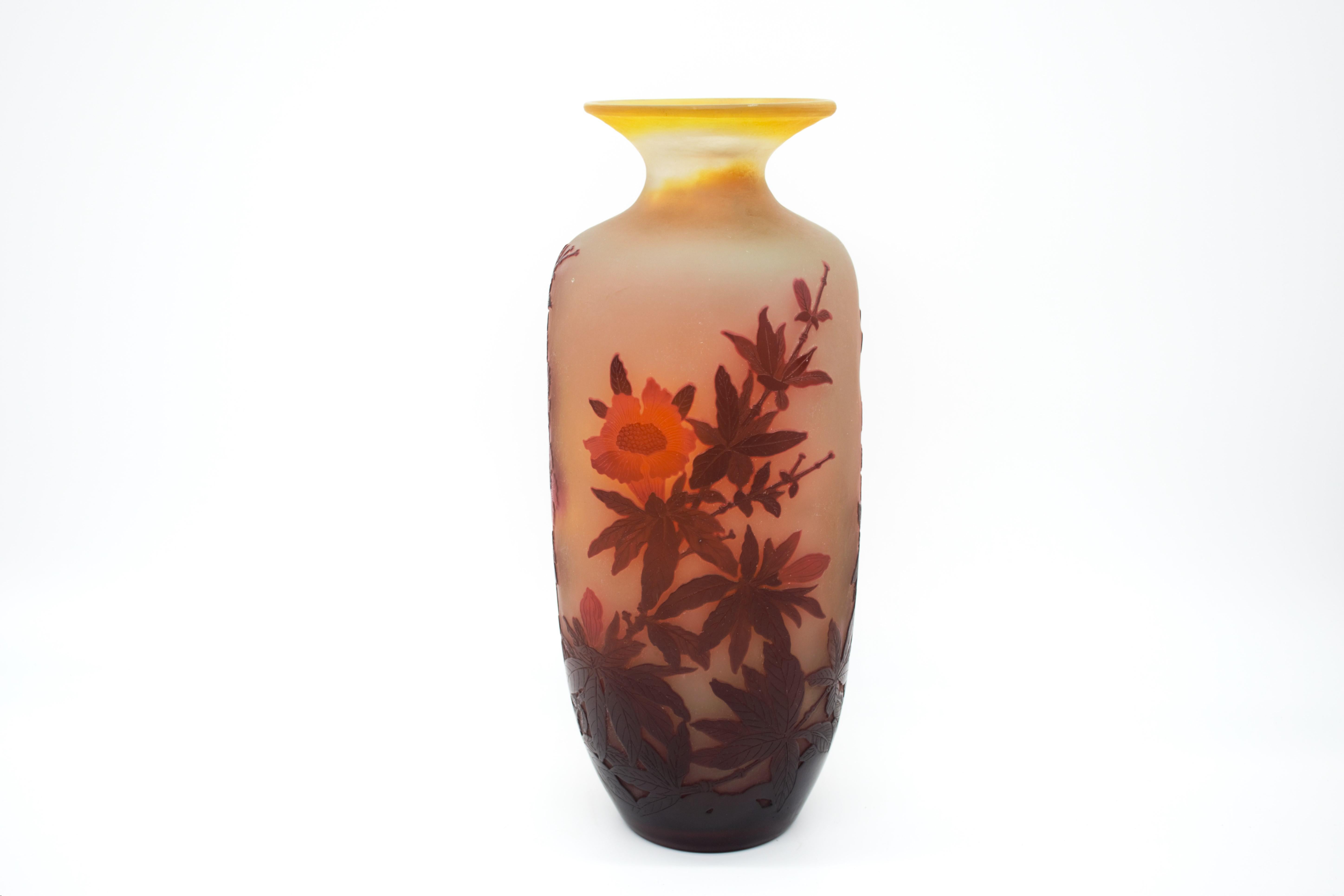 An attractive late 19th Century cameo glass vase of elongated square form cut with decorative burgundy and red flowers against a warm yellow background with excellent hand finished detail and colour, signed Galle in cameo, this vase is rare because
