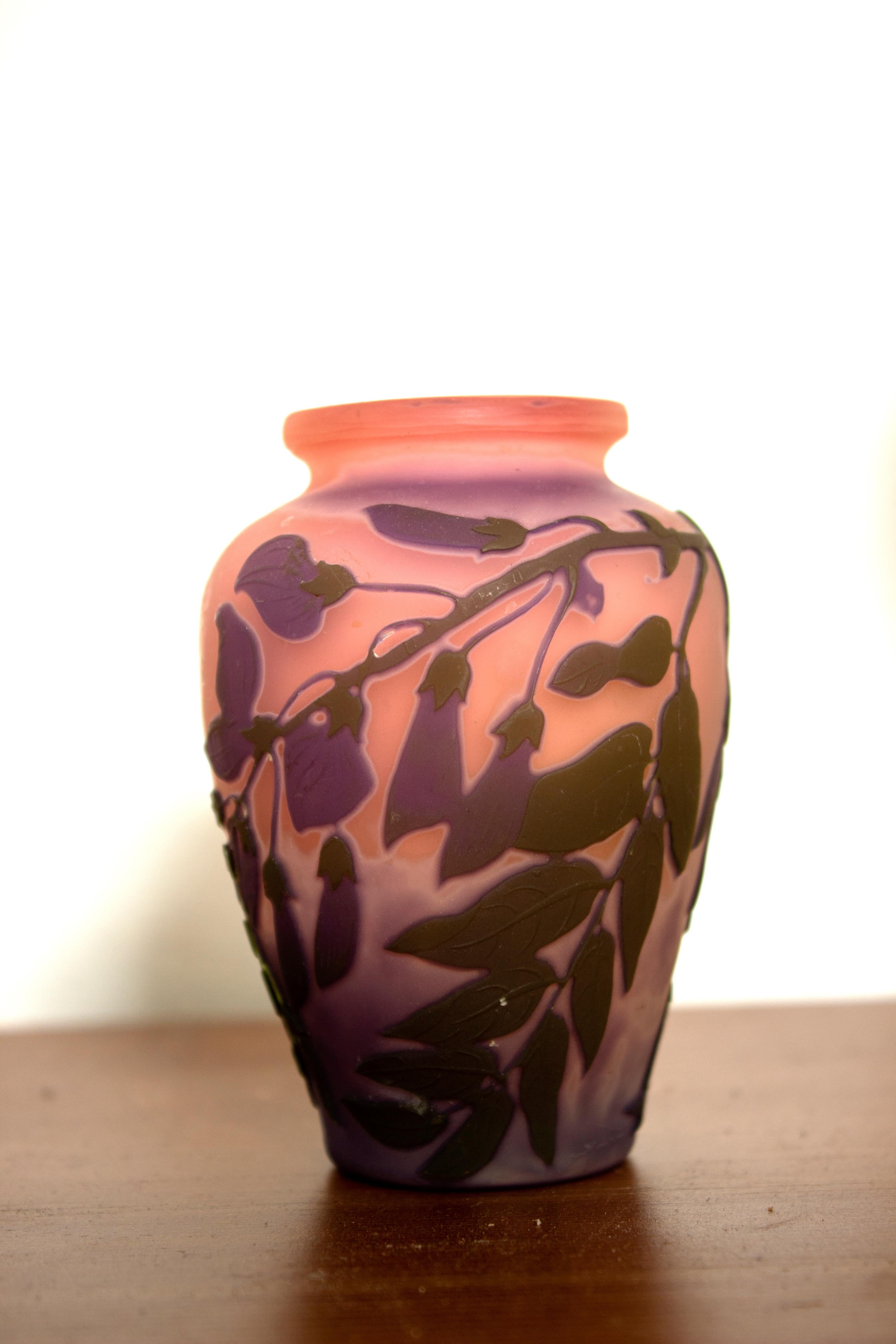 Baluster vase by Emile Galle, circa 1900.
The baluster cameo art glass vase shows acid cut lilacs and detailed leaves against a violet ground. The colours are superb.
The vase has the Galle mark as shown.
This piece is in excellent condition with