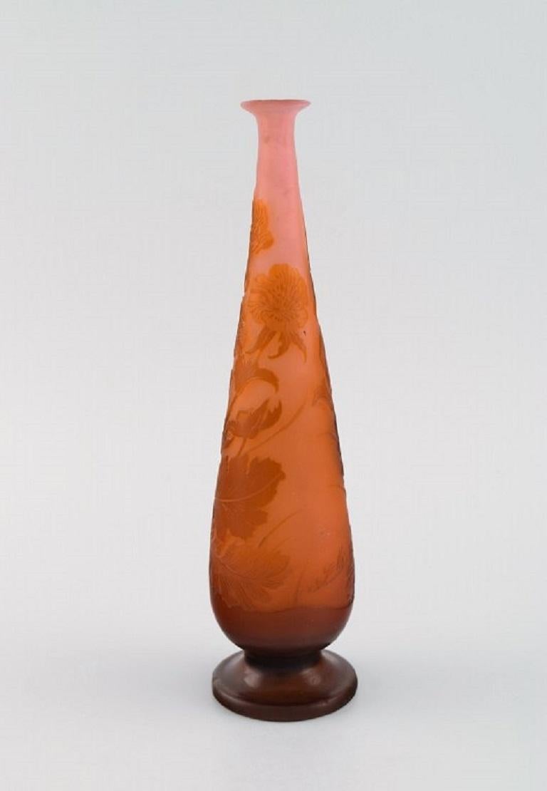 Emile Gallé vase in frosted and orange art glass carved in the form of flowers and foliage. 
Early 20th century.
Measures: 23.3 x 6.5 cm.
In excellent condition.
Signed.