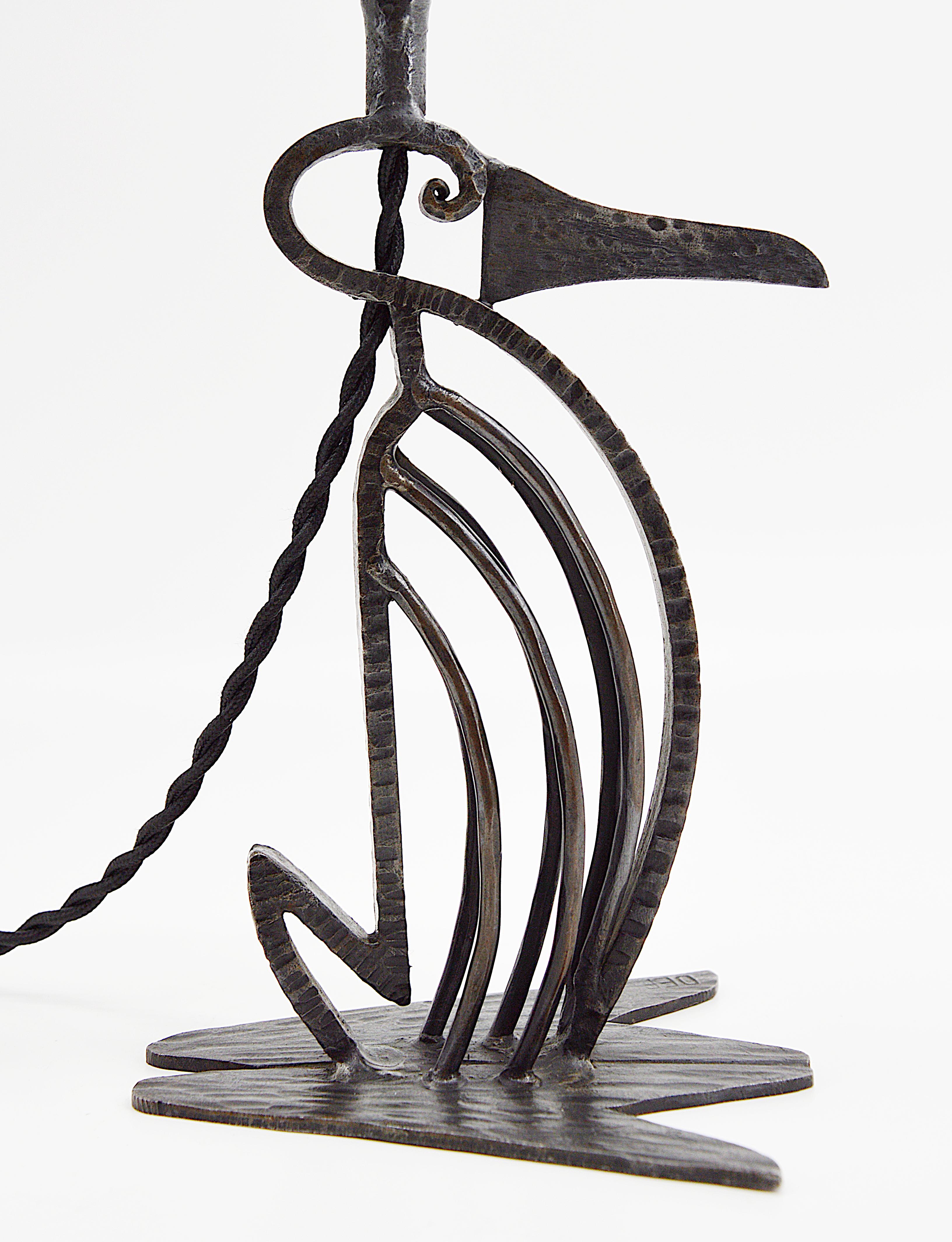 French Art Deco night-light perfume burner by Emile Gauthier, 180 rue Etienne-Marcel, Bagnolet, Paris, France and Fratelli Toso, Venice, Italy, 1920s. Charming wrought iron penguin by Emile Gauthier supporting a perfume burner lampshade by Fratelli