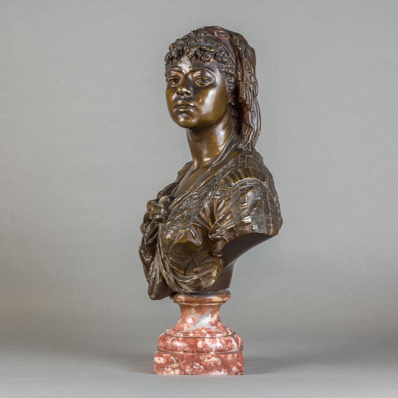 Bronze bust with brown patina on marble socle base. Red patina detail on head scarf. In beautiful condition, expertly cast and modeled. Perfect for an art collector looking for European work that depicts Black and African people. 
 
Signed on