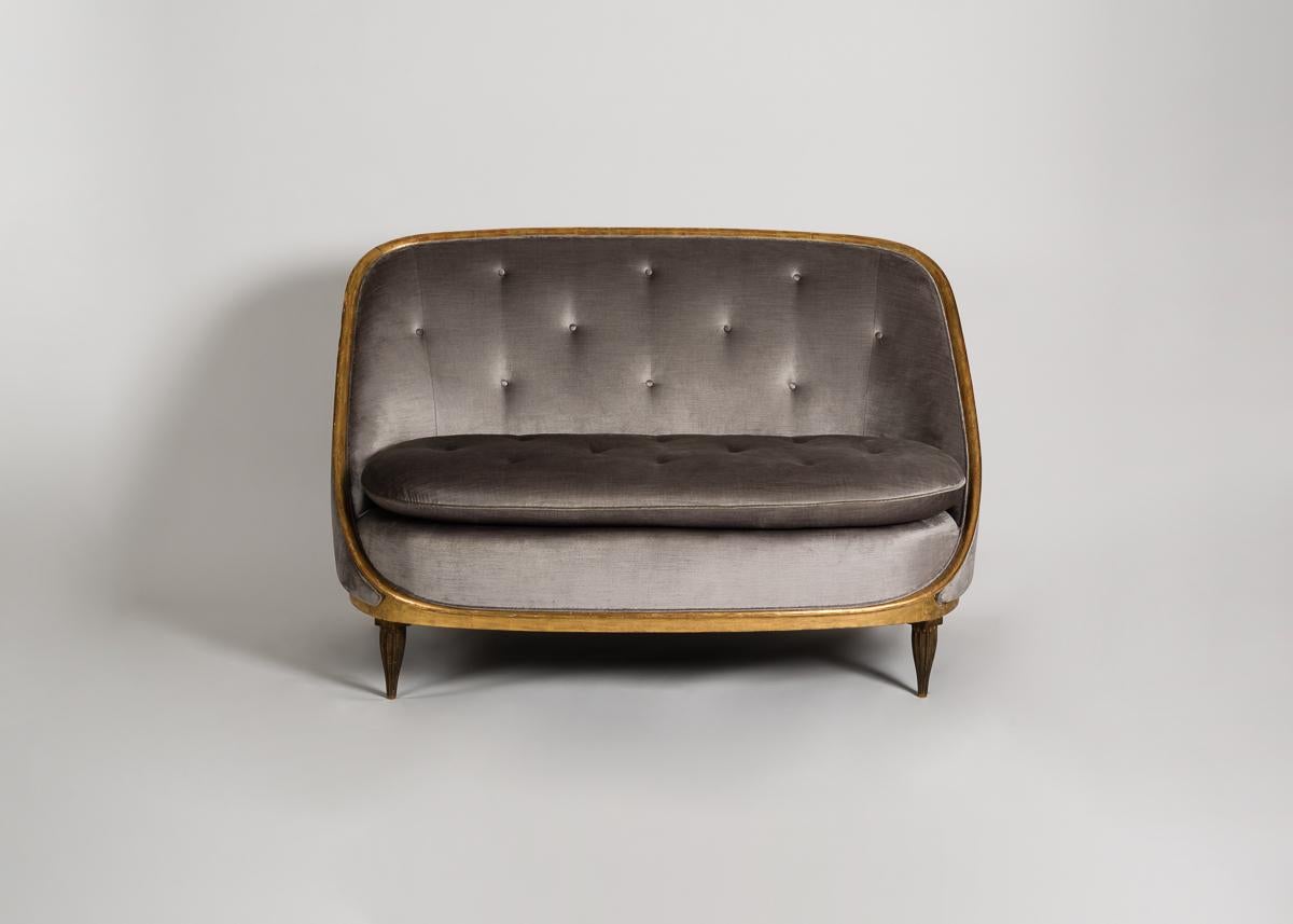 An extremely rare Ruhlmann settee with carved gilt-wood feet and accents that unite a broad back, plush seat, and delicate sloping arms.

*All proceeds from the sale of this piece benefit Bard Graduate Center's Scholarship Fund.