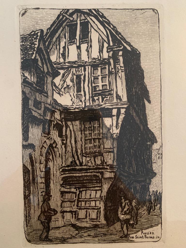 Beautiful engraving representing half-timbered houses in a medieval street. It is signed by Emile Leroi, born in 1887 and died in 1944, a French impressionist painter. The print is in black and white, with two houses and seven people in the street.