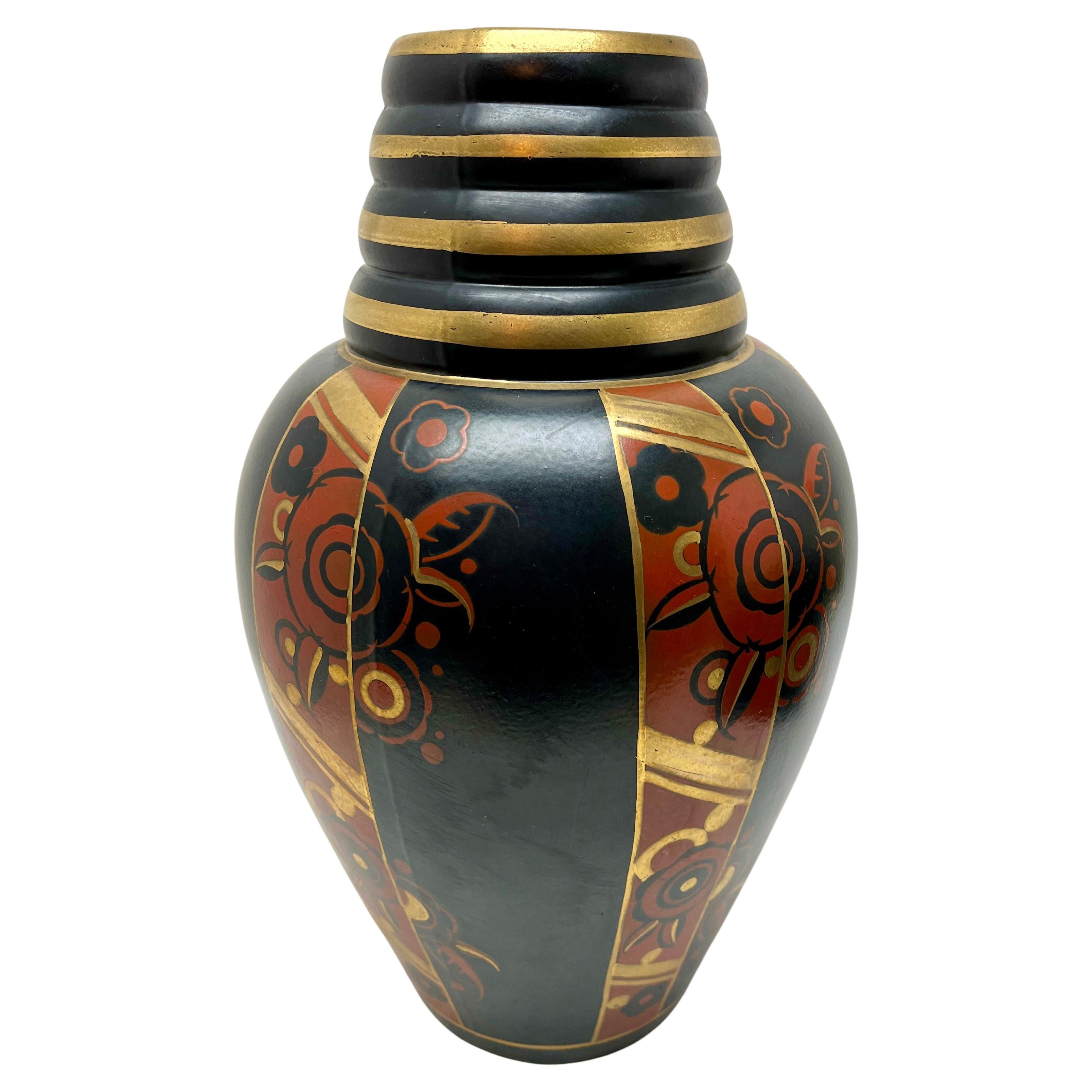 Famous rare Emile Lombard vase for Ghislain Belgium and a typical beautiful example of the art deco period and dates from circa 1930

Earthenware -Faiencerie de Saint Ghislain, Belgium -Height 35 cm -Width 22 cm -Black background, copper neck,