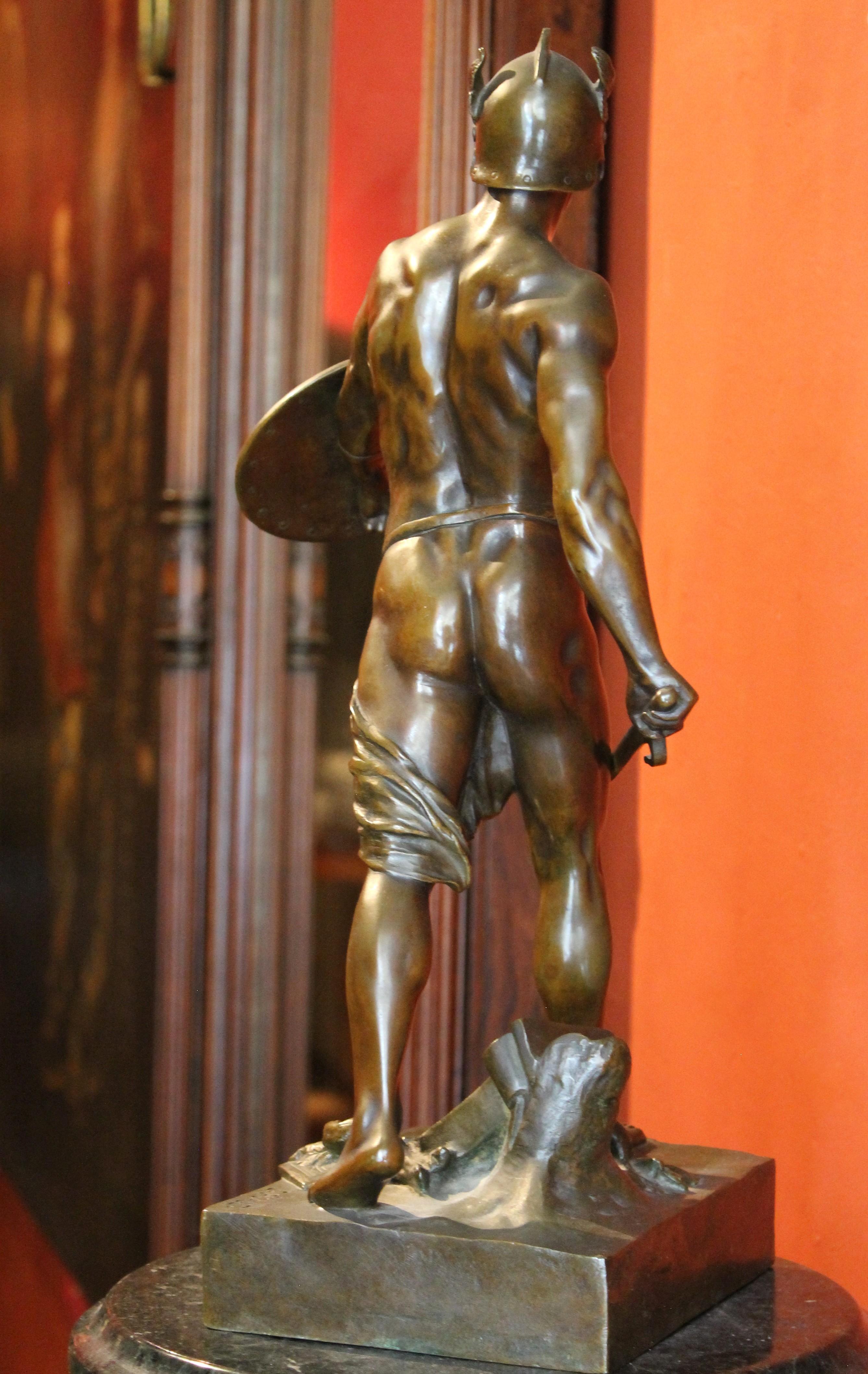 This extraordinary French burnished bronze figurative sculpture featuring a Gallic warrior victorious over the Roman legion was crafted in late 19th Century (1890 ca) by famed French sculptor E´mile-Louis Picault, one of the most celebrated