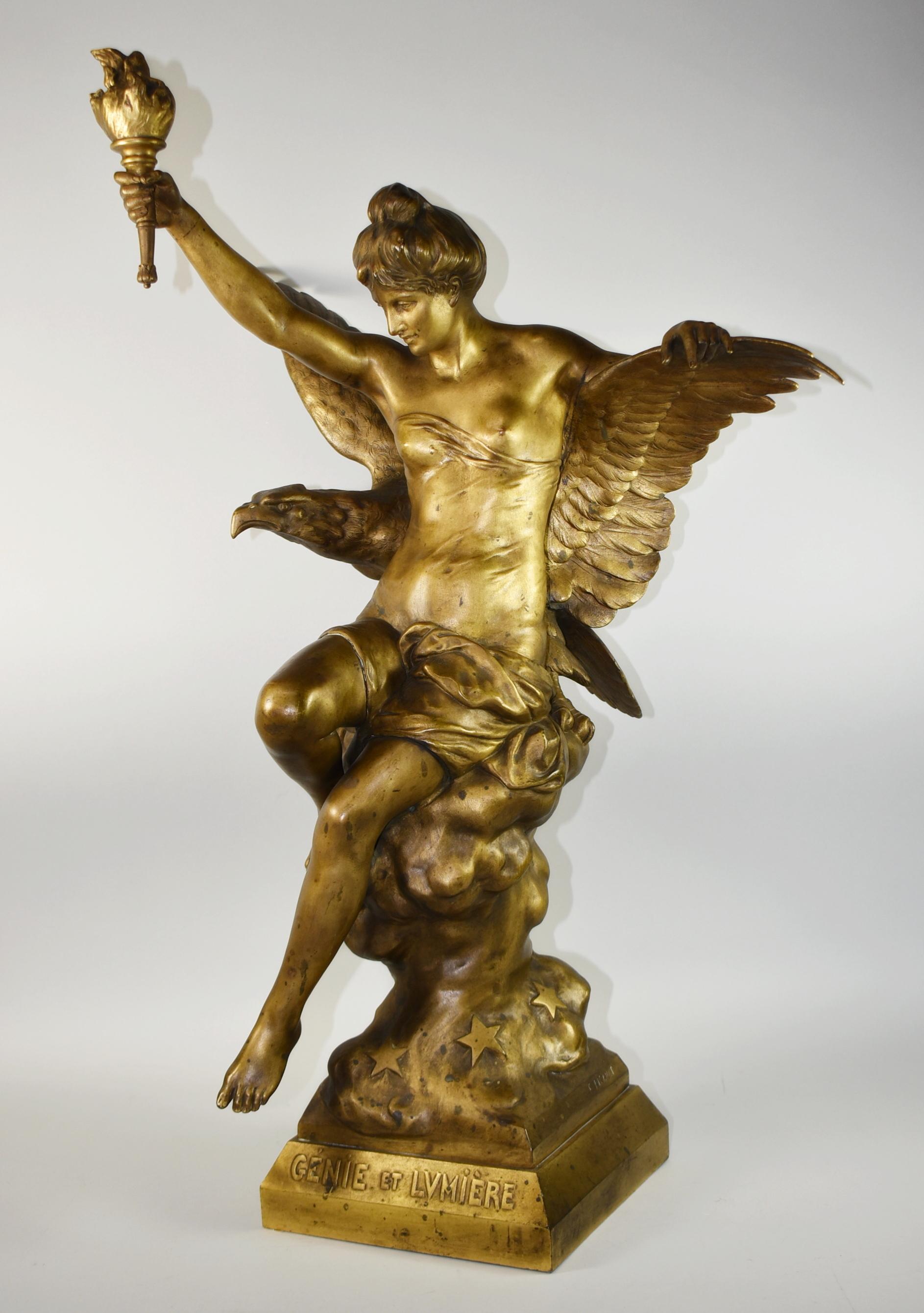 Beautiful bronze sculpture by Emile Picault. This statuary is of a woman holding a torch sitting on a rock with stars. An eagle with outstretched wings stands behind her. The eagle has great details in the feathers and head. Bottom of sculpture has