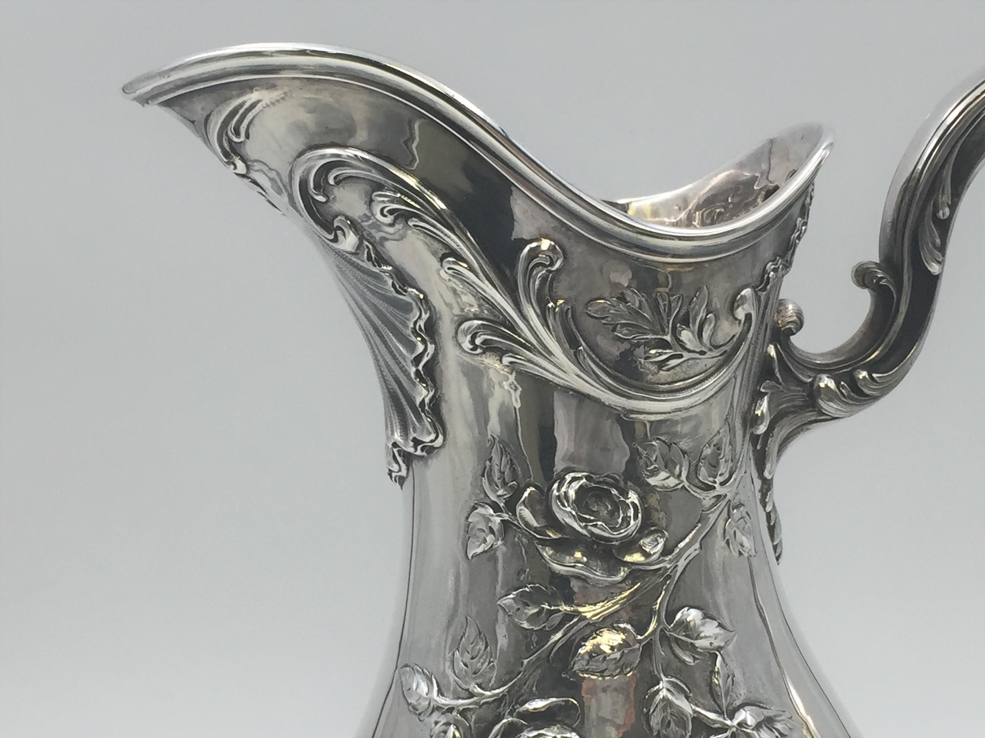 Late 19th/ early 20th century French 0.950 (higher purity than sterling) silver ewer / pitcher by renowned silversmith Emile Puiforcat with exquisite floral and geometric patterns. Measuring 14 1/4'' in height and 10'' from handle to spout and
