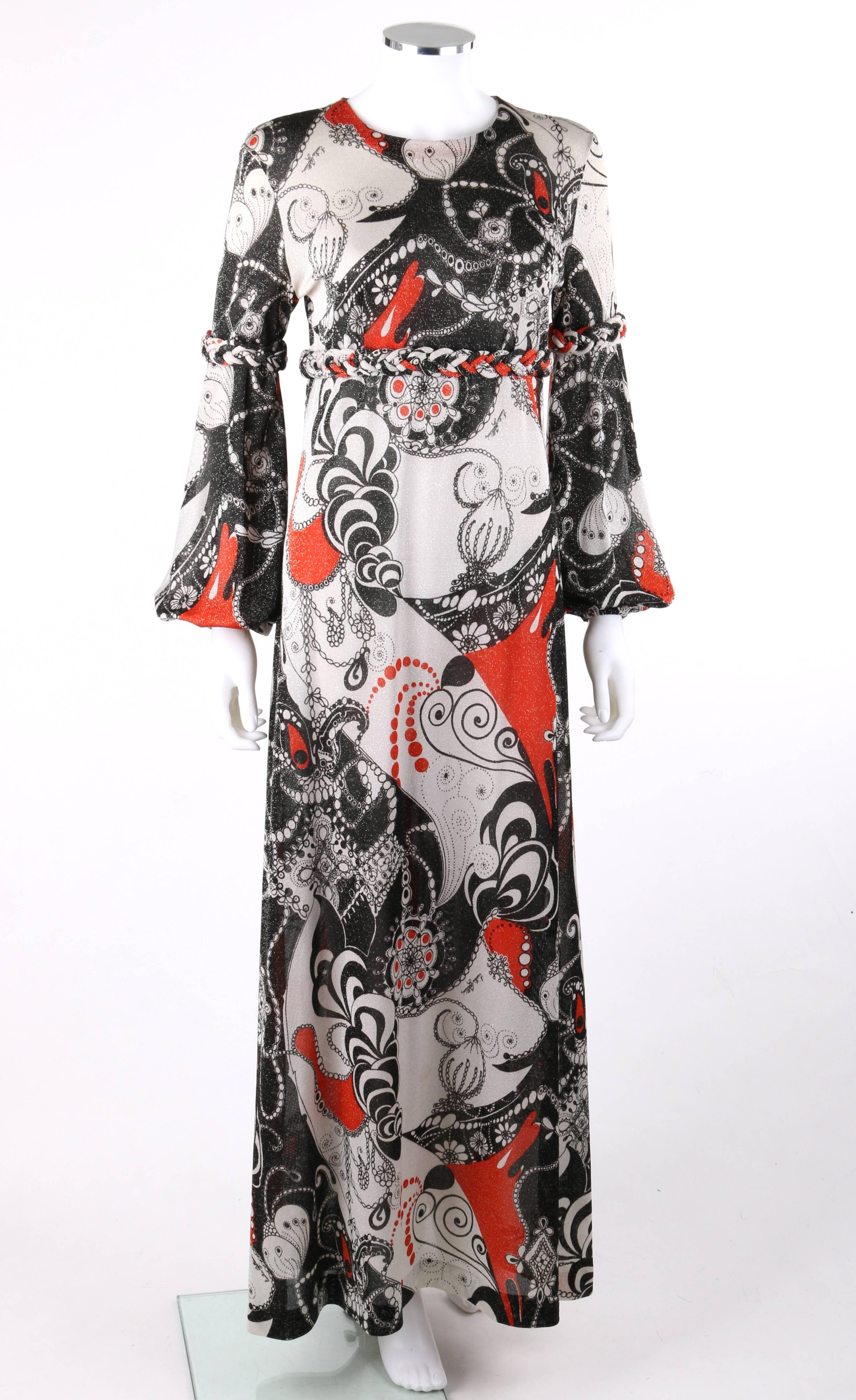 Vintage Emilia Bellini c.1960's op art signature print silk metallic knit maxi dress. Large floral ornate op art signature print metallic silk knit in shades of black, white, and red. Scoop neckline. Long bishop sleeves with elastic cuff. Empire
