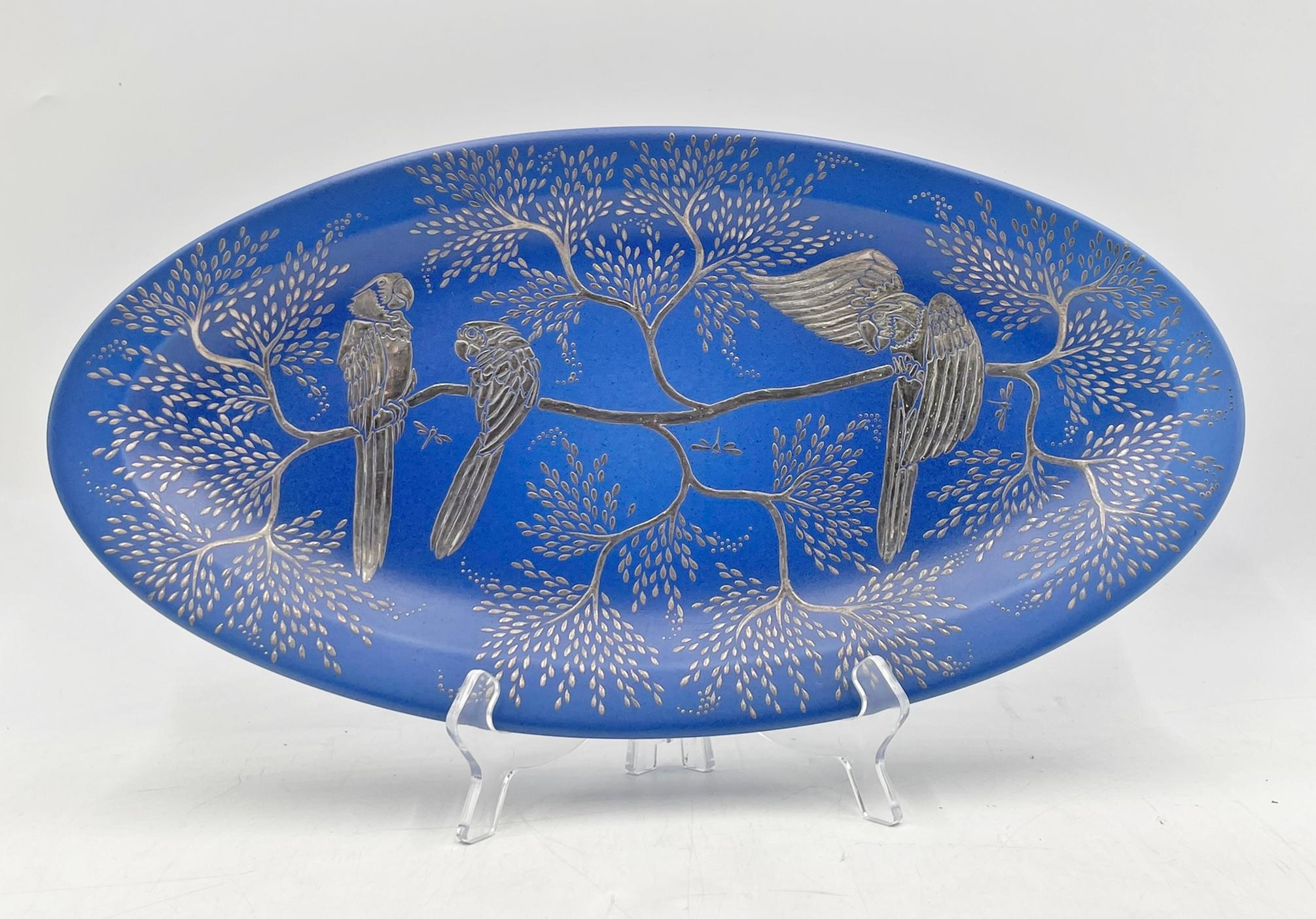 Exceptional Emilia Castillo porcelain and pure silver platter, dated 1994 and hand signed Emilia Castillo, M.R., Mexico, #13. Measuring 17 inches wide, this museum-quality piece showcases Castillo’s signature aesthetic: nature-inspired motifs